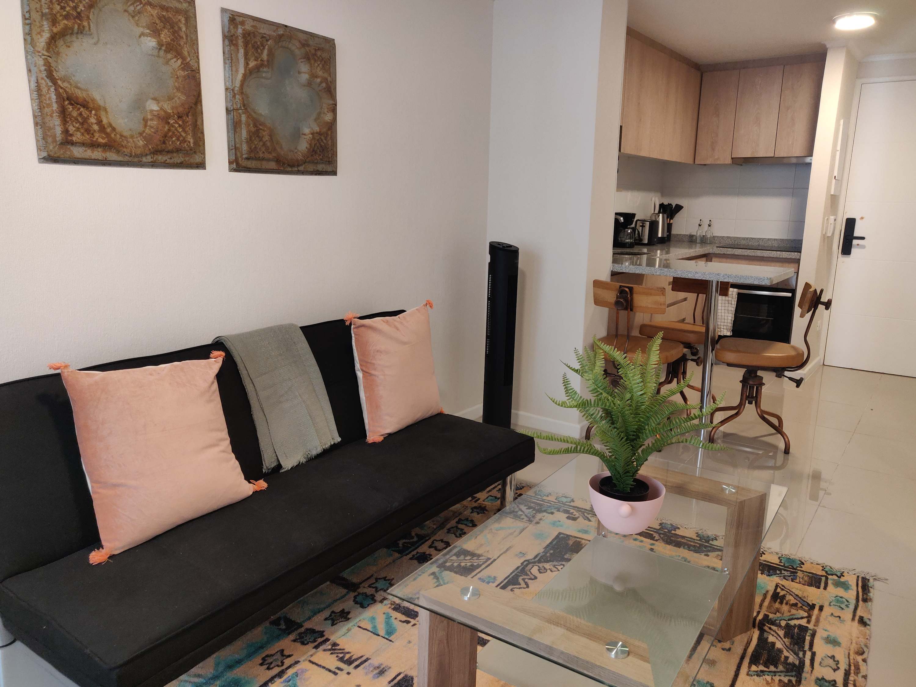 Charming studio with a cozy living space and modern kitchen, perfect for a relaxing stay in Chile.