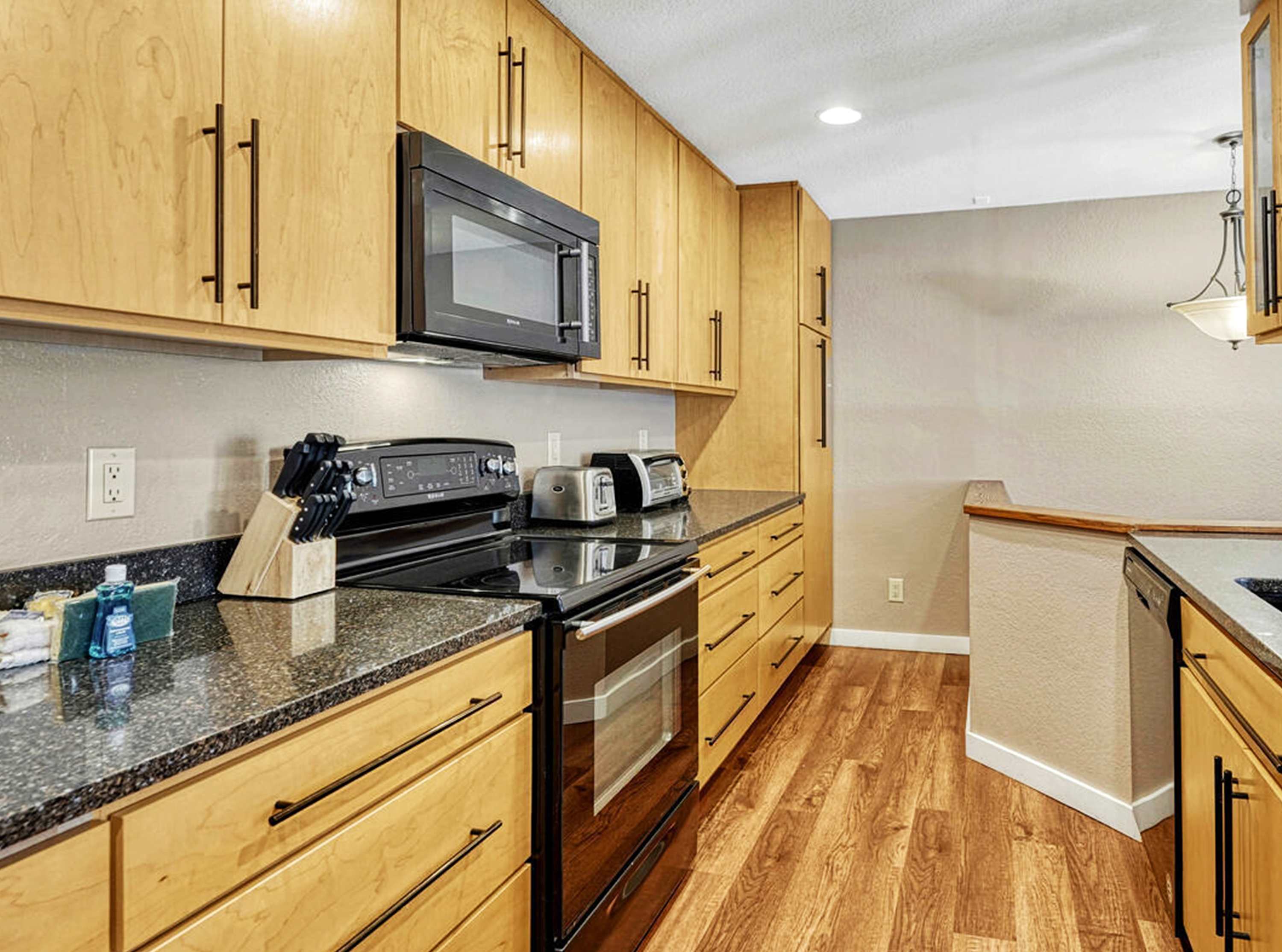 The cozy kitchen is well equipped for an unforgettable getaway​