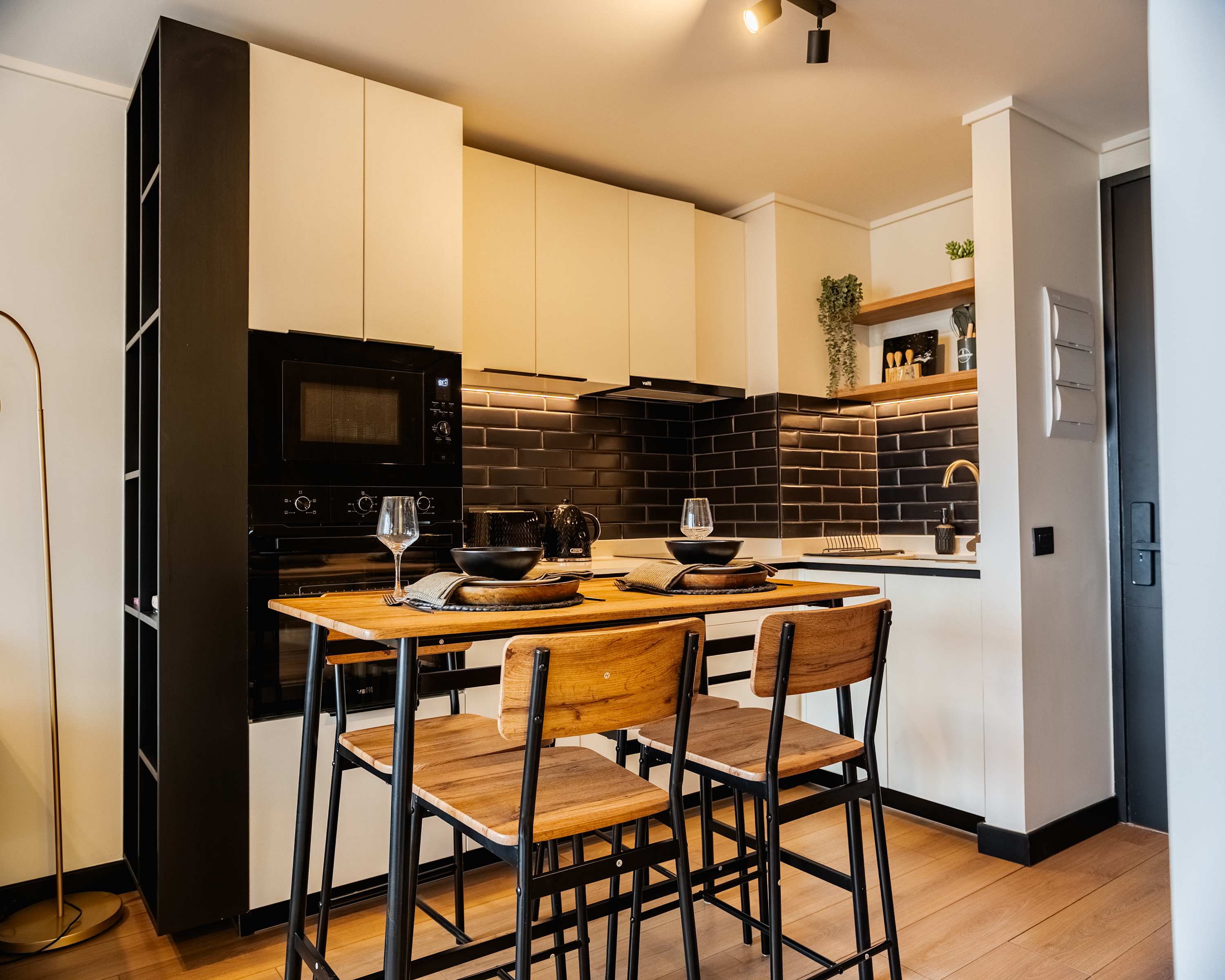 Stylish and modern kitchen with sleek finishes, perfect for cooking and dining in comfort.