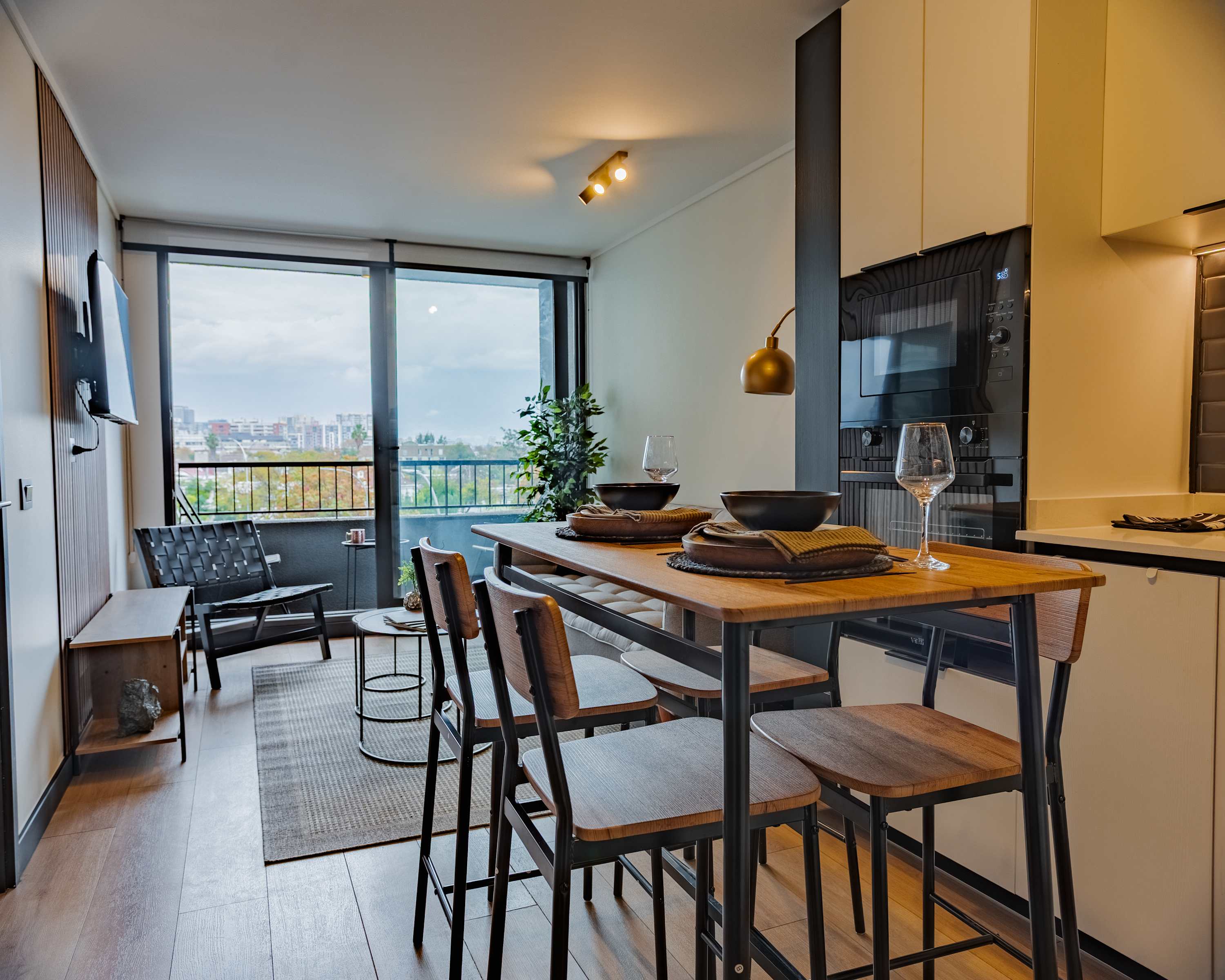 Enjoy city views from this stylish studio with modern amenities and a cozy dining area, perfect for a relaxing stay.