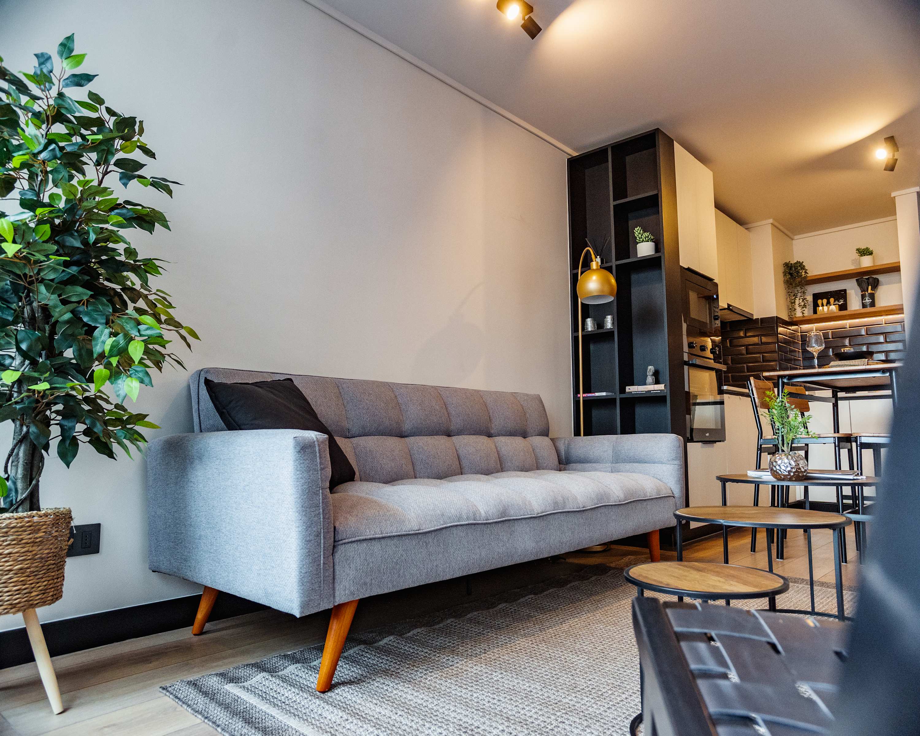 Cozy and stylish living area with modern kitchen, perfect for relaxing after exploring the city.