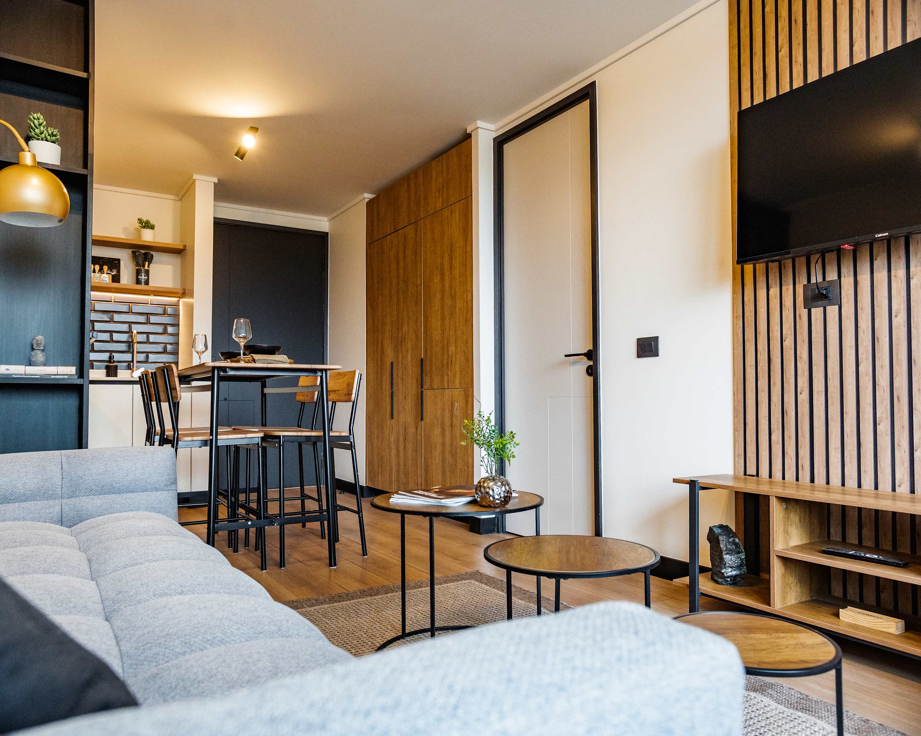 Cozy and modern living area with stylish decor, perfect for relaxing and dining in comfort.