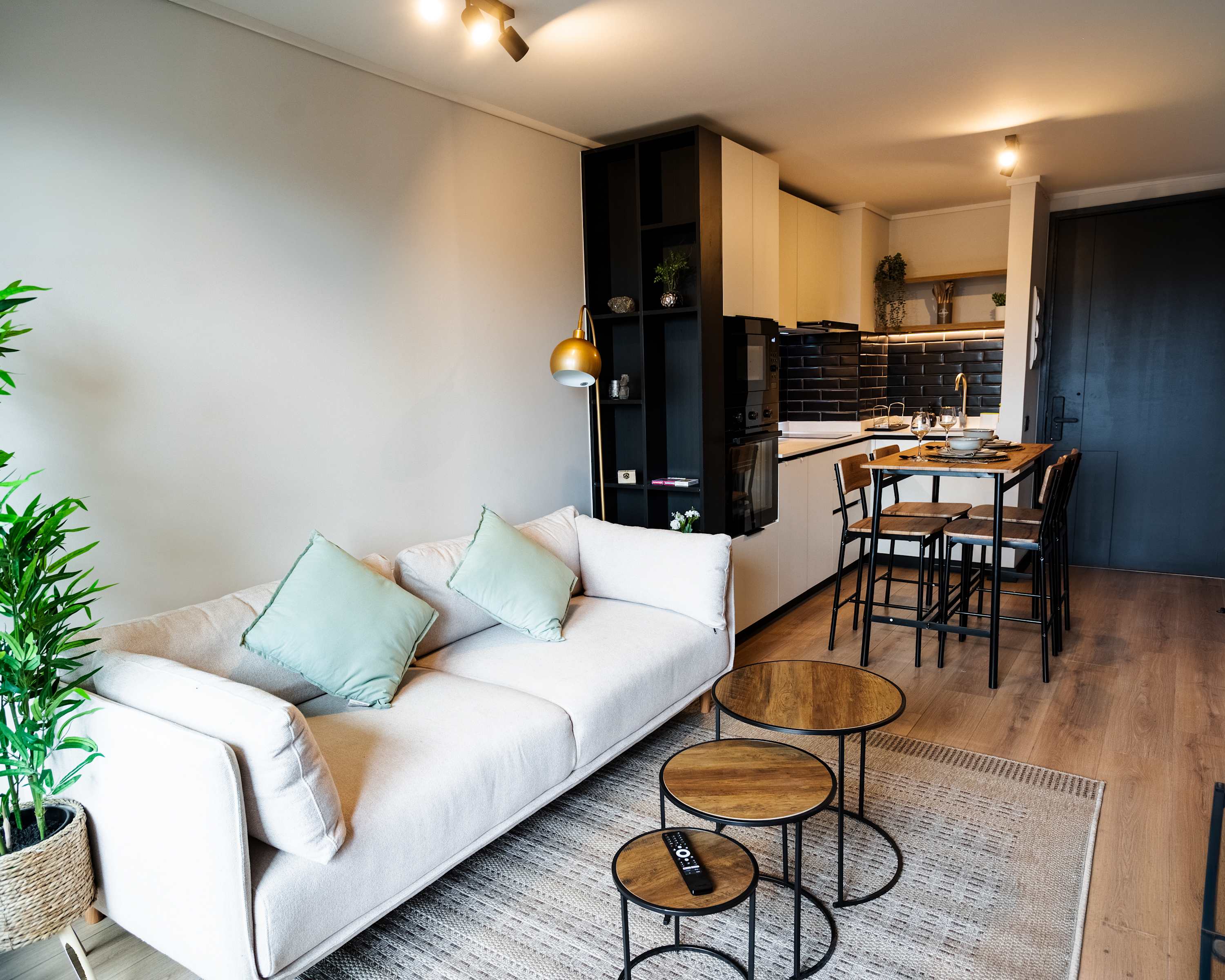 Cozy and modern studio with a stylish living area and fully equipped kitchen, perfect for a comfortable stay.