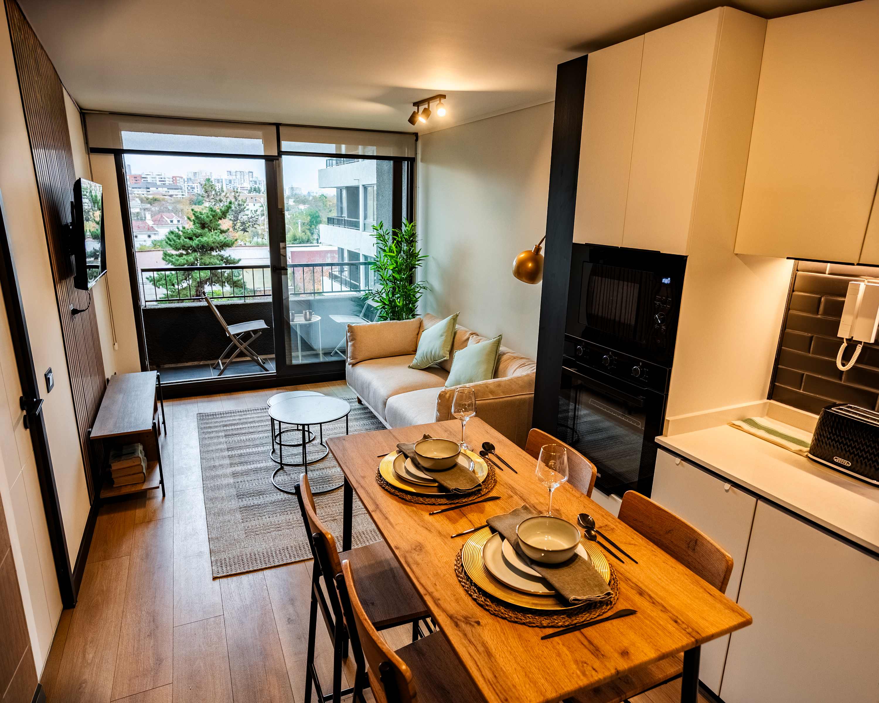 Cozy and modern studio with a balcony view, perfect for a relaxing stay in the city.