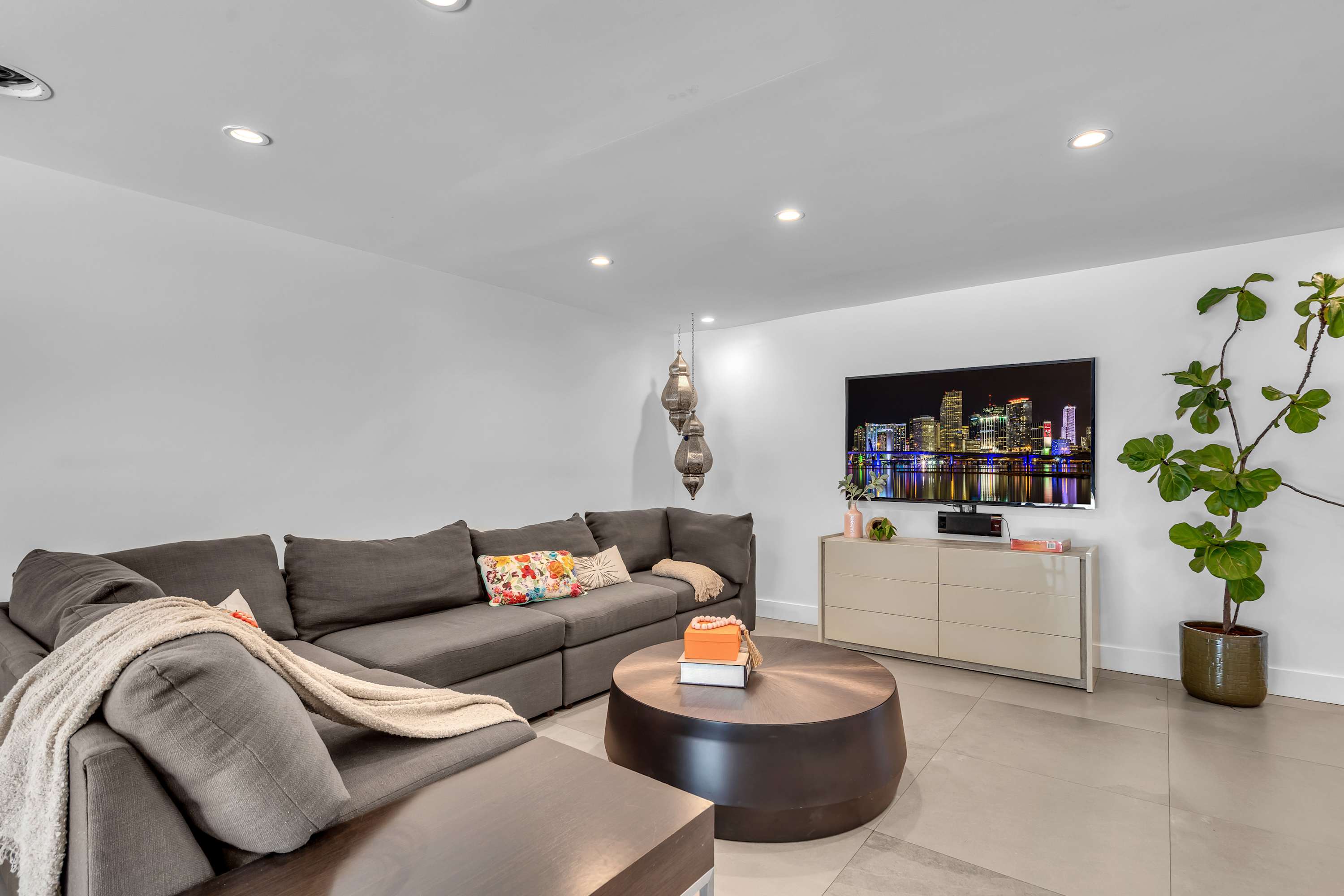 Curl up in the chic living room & stream your favorites on the smart TV​