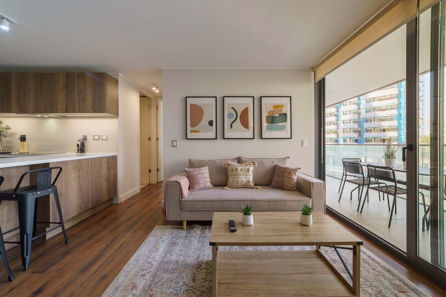 Relax in this stylish living room with balcony access, perfect for enjoying the city views and fresh air.