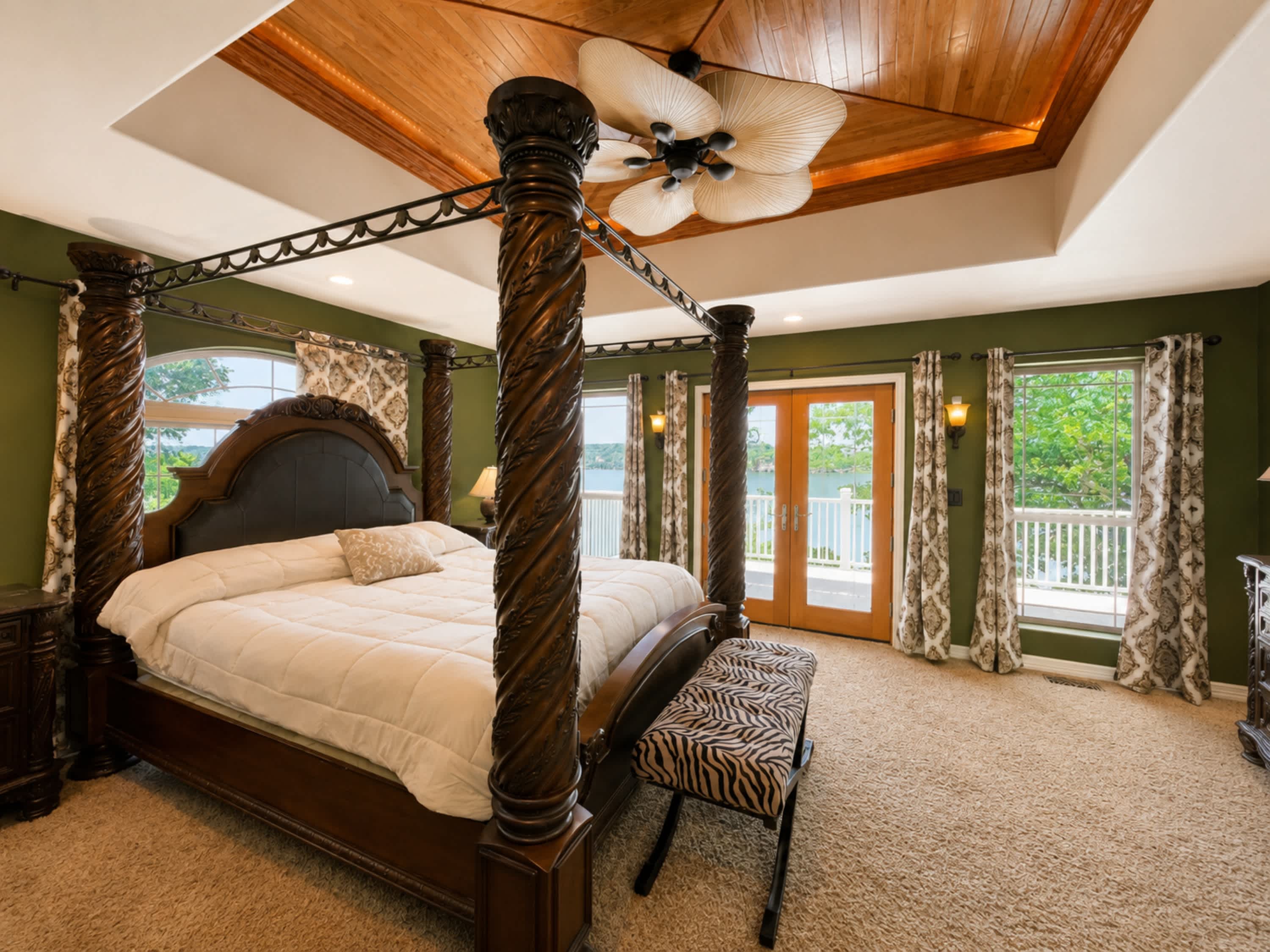 Recharge in the chic primary king suite, boasting a smart TV, ensuite, & deck access​