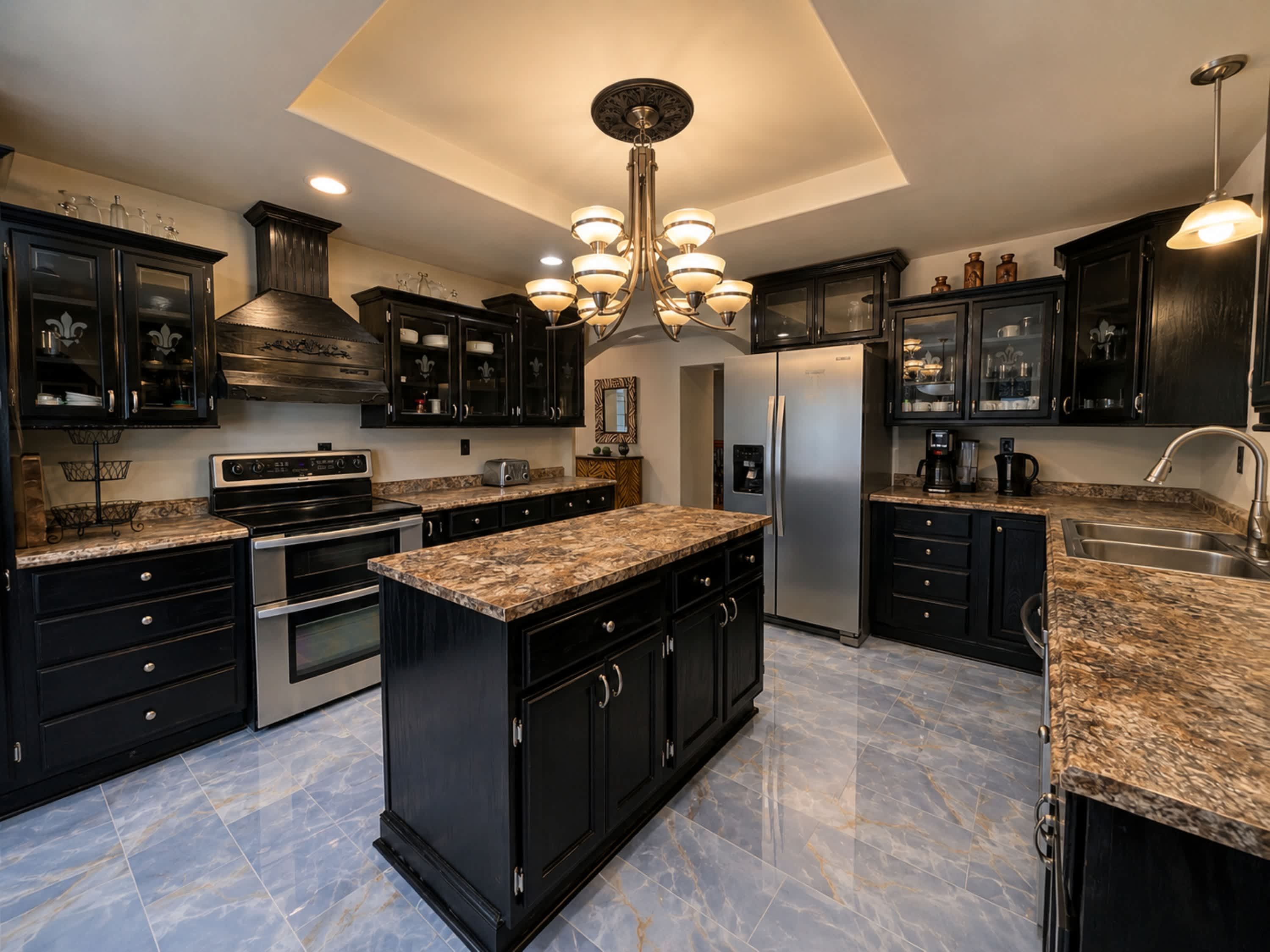The elegant kitchen offers ample space & all the comforts of home​