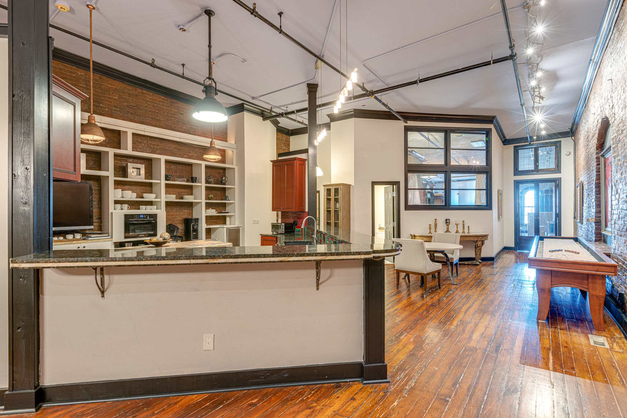 Gourmet kitchen with sleek finishes and views.