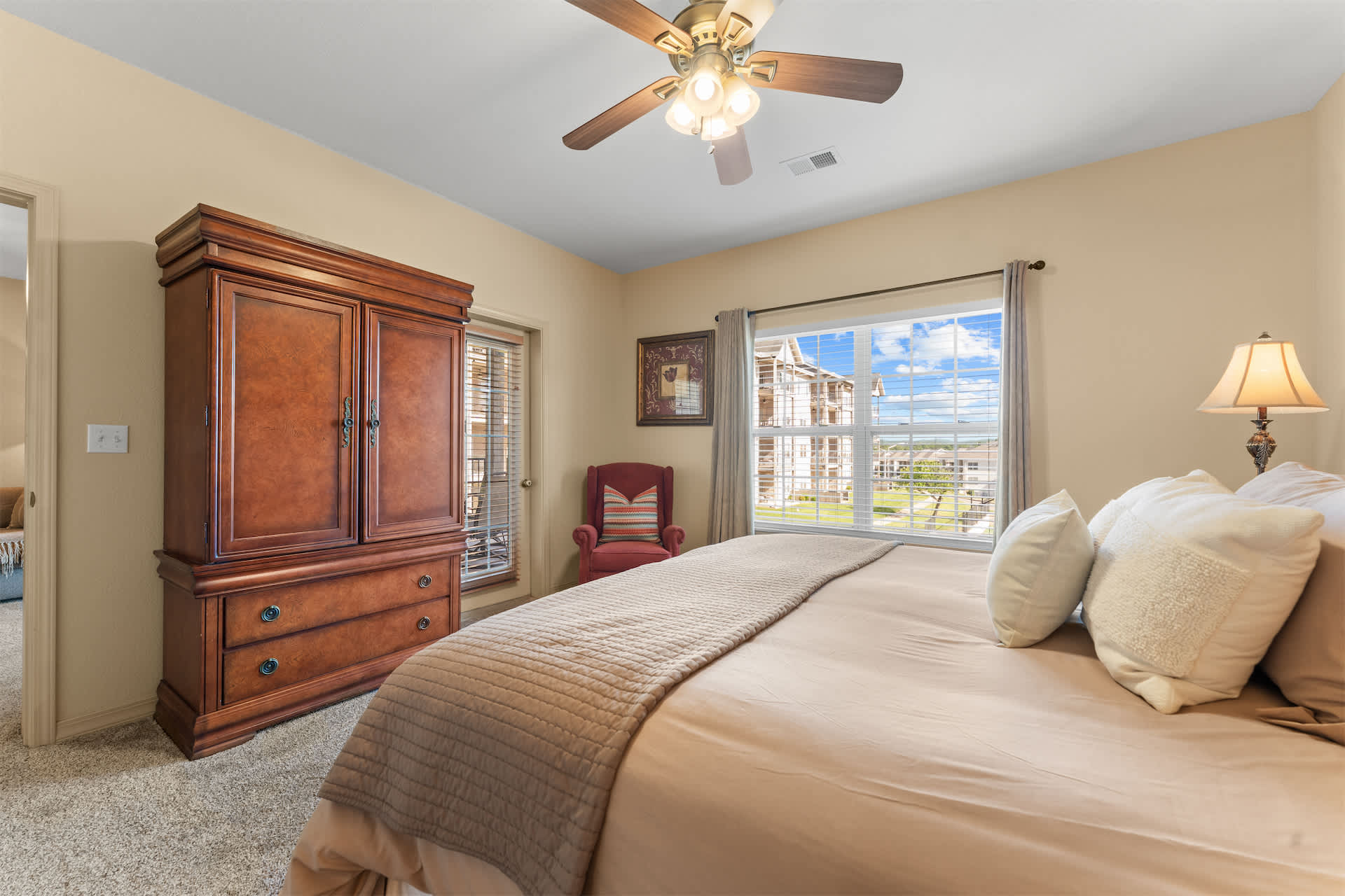 The primary king suite boasts balcony access & a private ensuite​