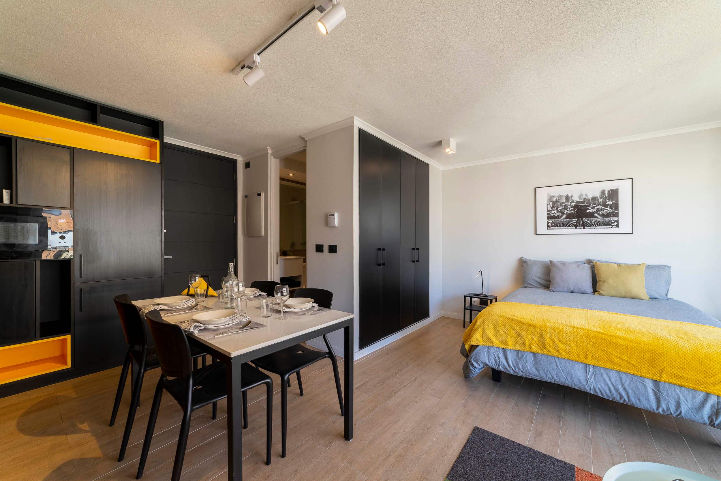 Stylish studio with modern amenities and vibrant decor, perfect for a cozy stay in the heart of the city.
