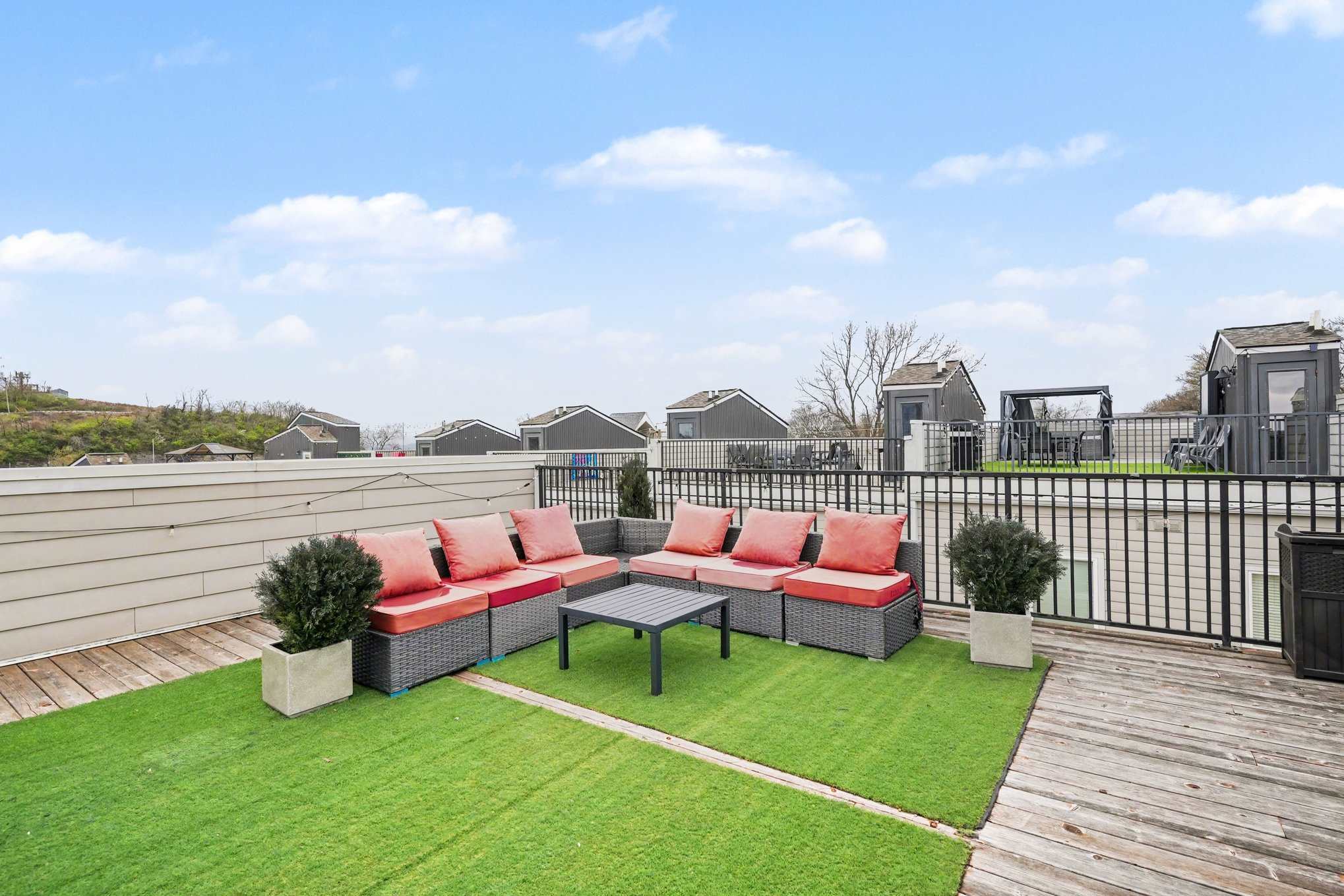 Rooftop patio with grill, corn hole, and views perfect for lounging. | Unit B