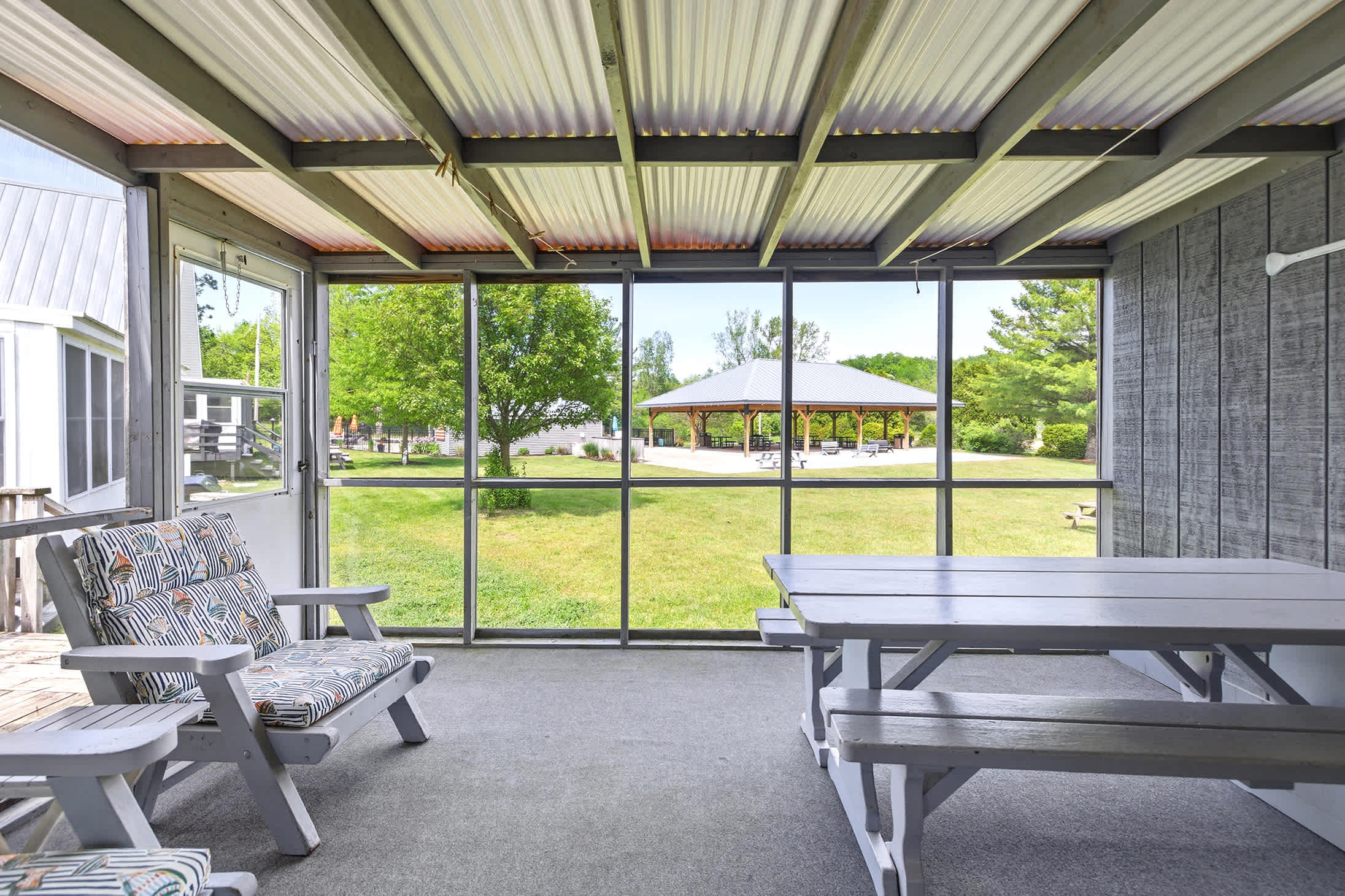 Screened porch dinners and open-air mornings are part of the lakeside experience.