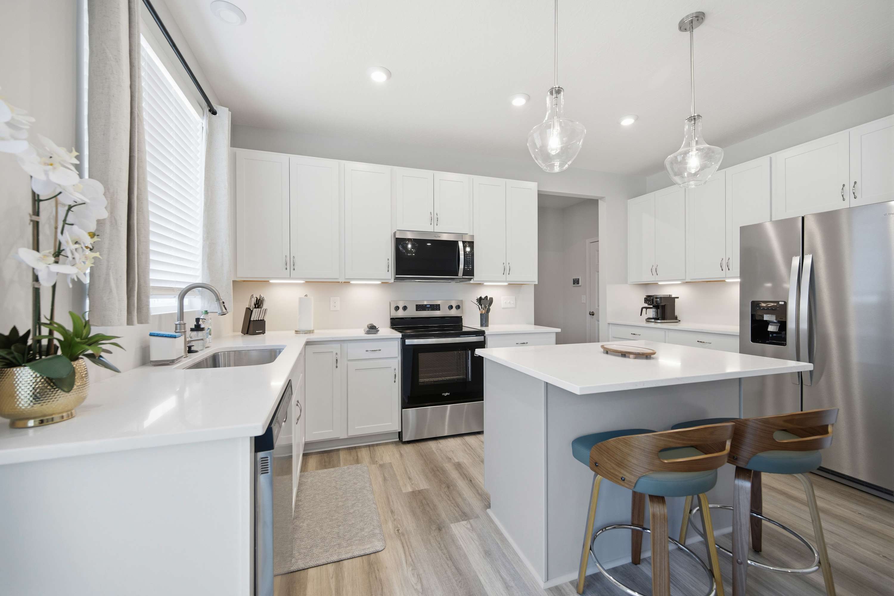 The sleek, open kitchen is well equipped for an unforgettable getaway​