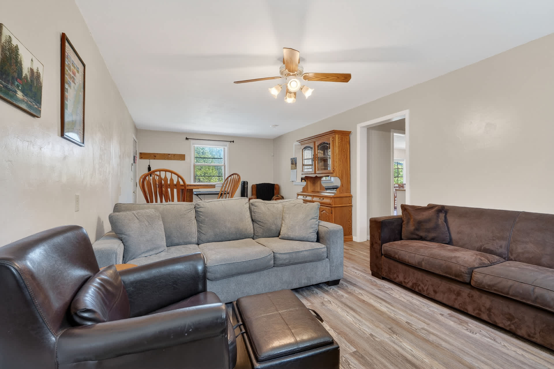 Adjacent to the kitchen is a sitting room, complete with TV, piano, and games for the family!