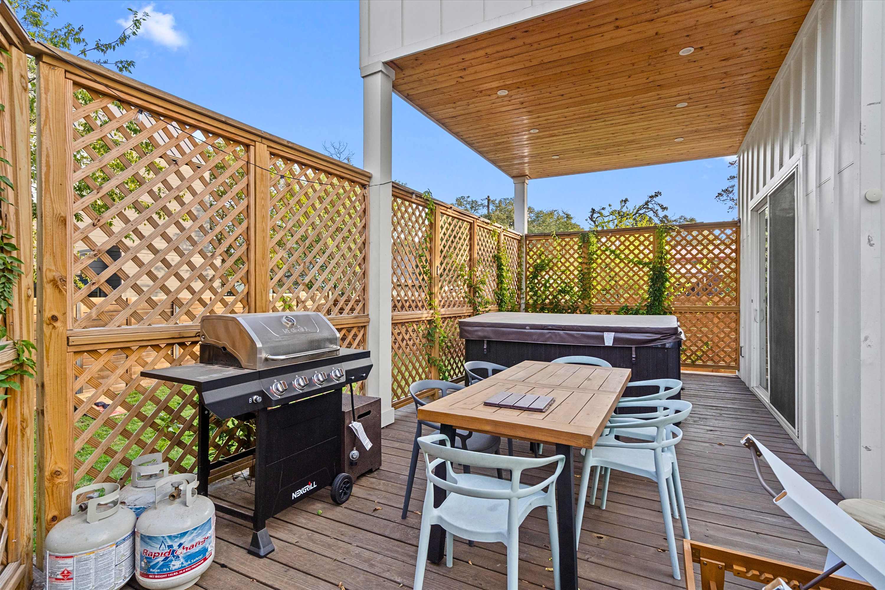 Enjoy the outdoor hot tub, fire up the BBQ grill, and share meals together in the outdoor dining area after a day exploring Austin