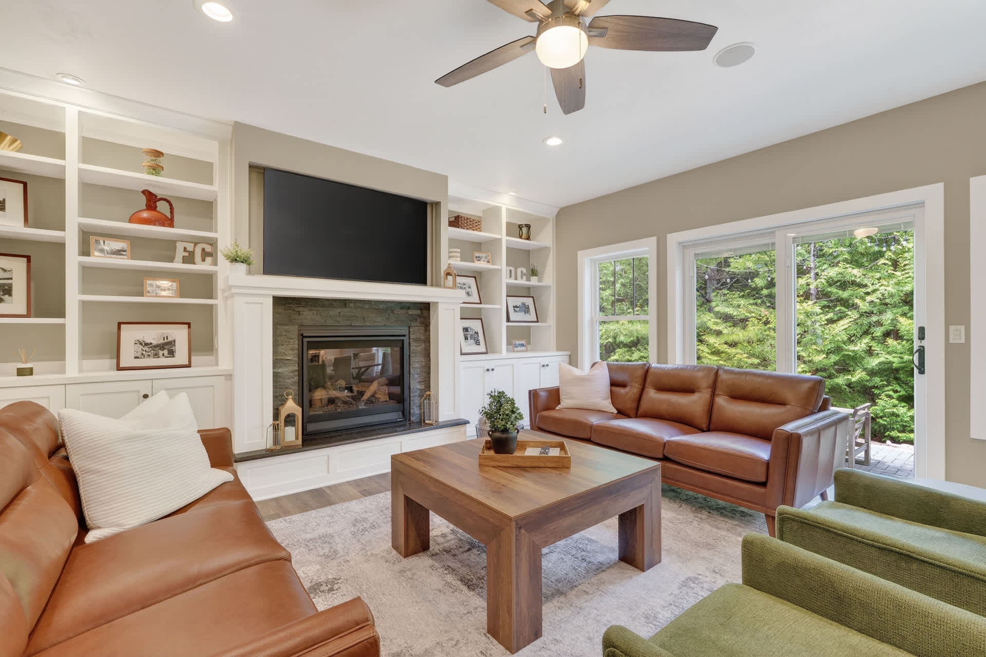 Sink into plush leather sofas and enjoy your favorite shows by the fireplace, with garden views framing your cozy retreat.