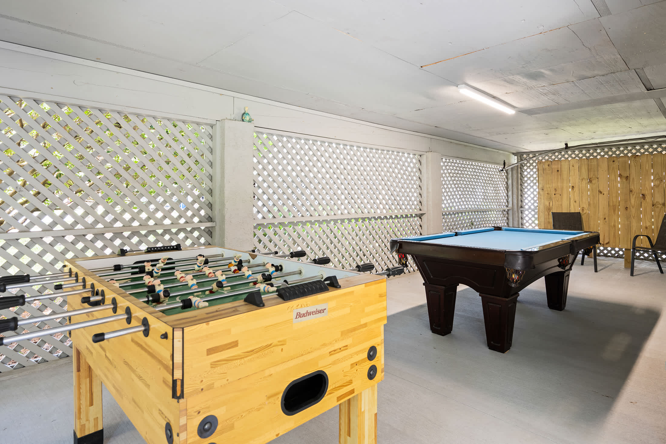 Outdoor game room under house