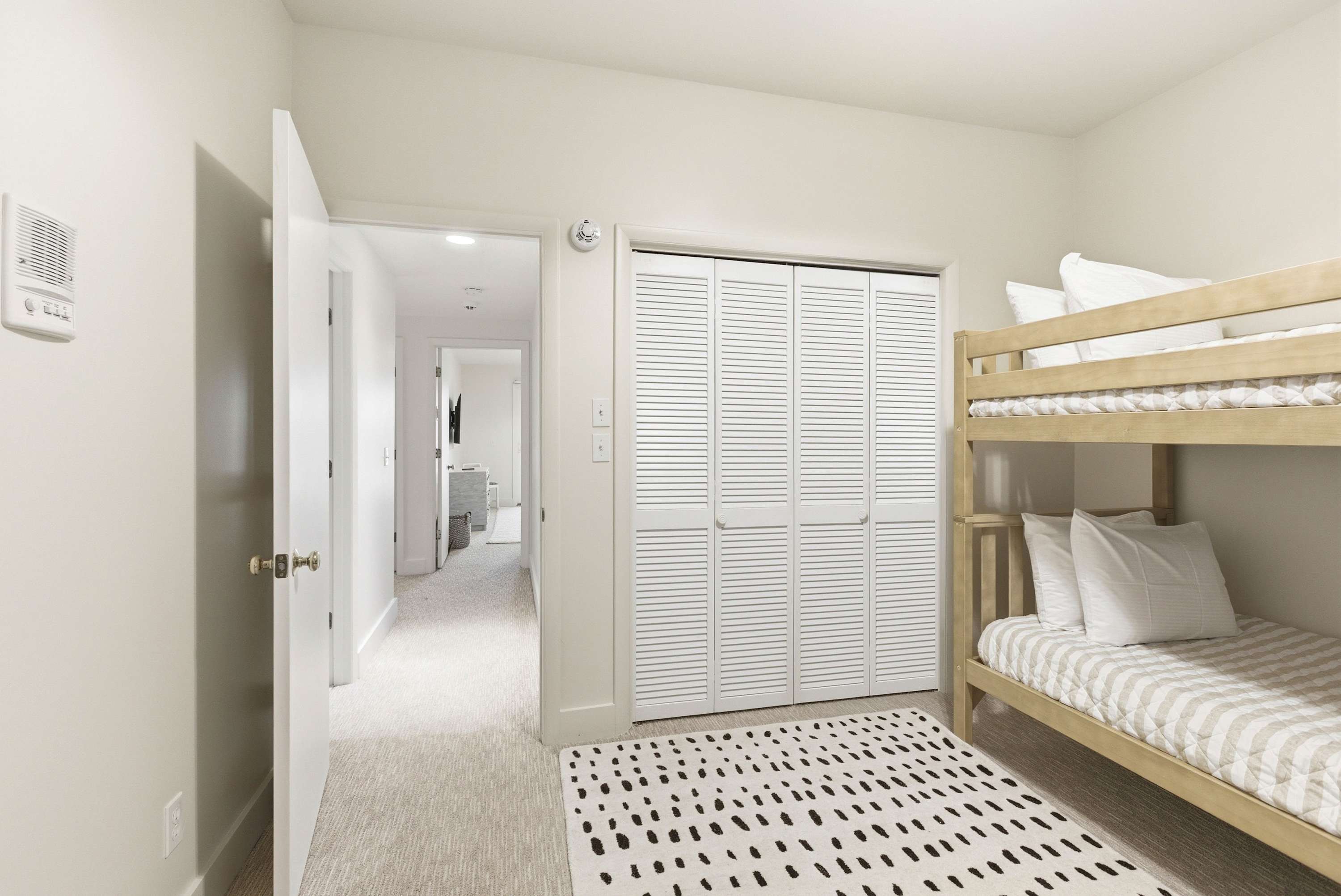 The bunk suite features ample closet space and easy hallway access for the whole crew.