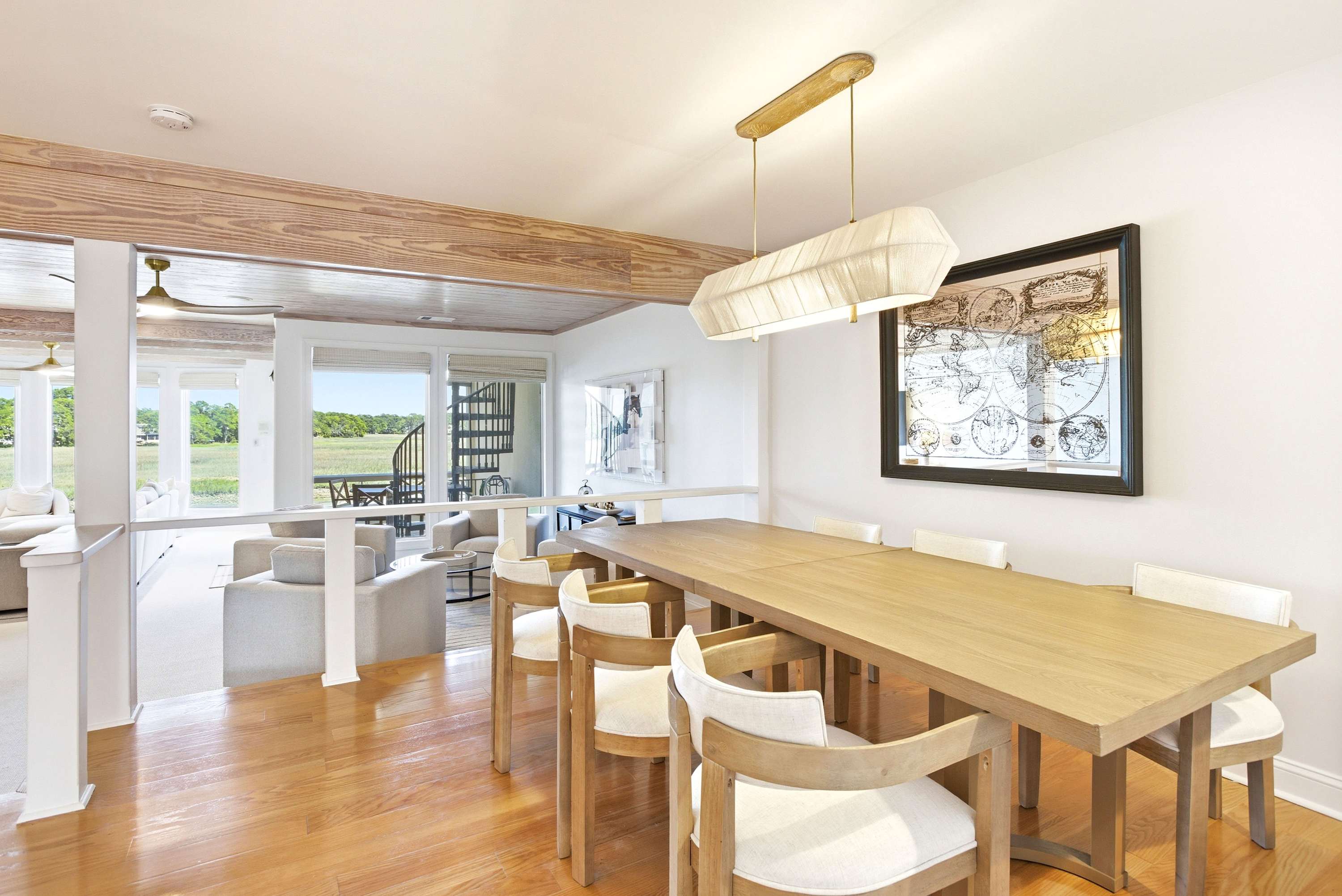 The dining room flows seamlessly into the main living area, keeping everyone connected while the water views do the decorating.