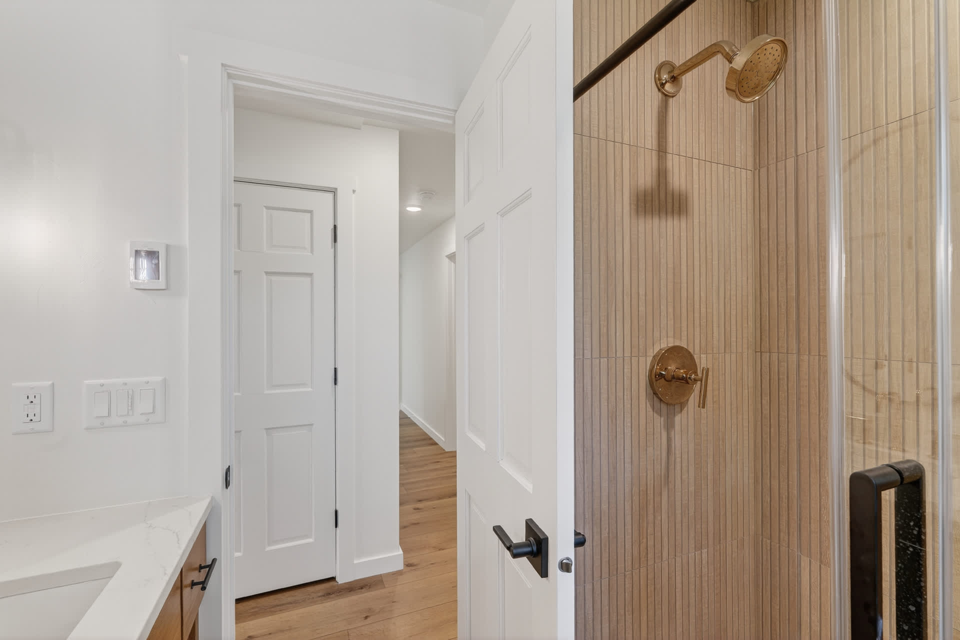 Gorgeous remodeled bathroom with walk in shower. Threshold into shower is low :)