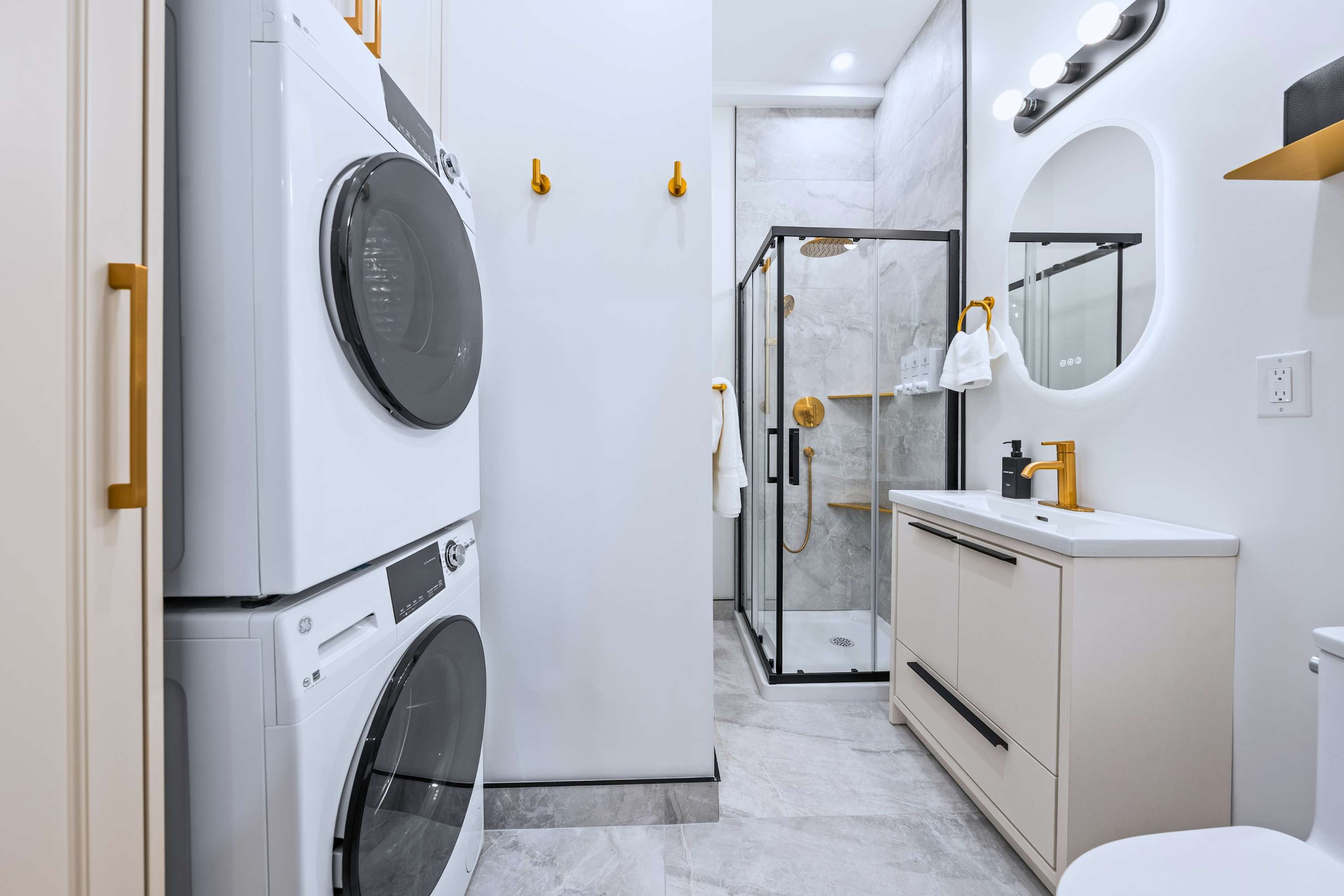 Bathroom with walk in shower and in unit washer and dryer for added convenience