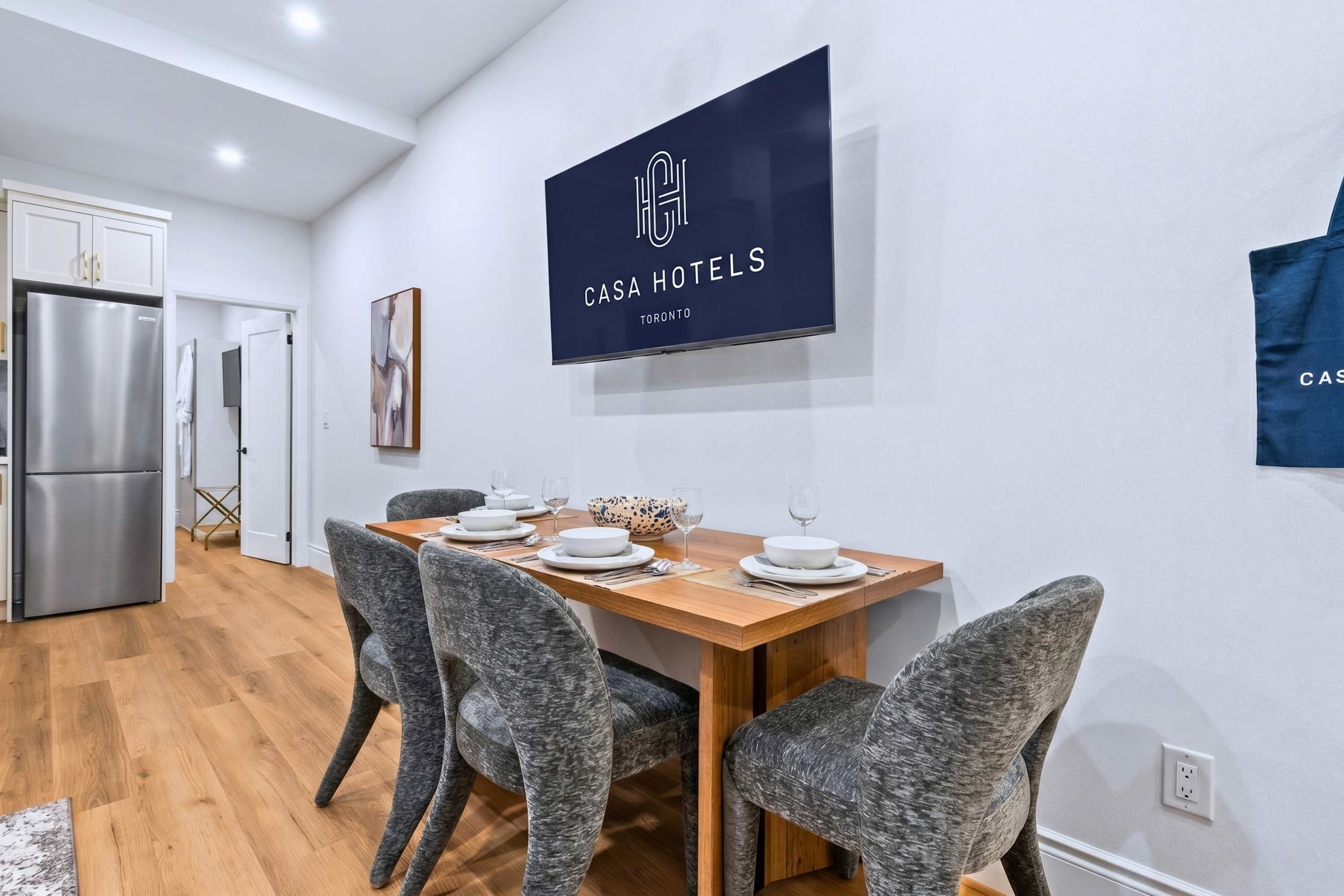 Dining space with Smart TV and thoughtfully prepared essentials that make every meal and moment feel easy and welcoming