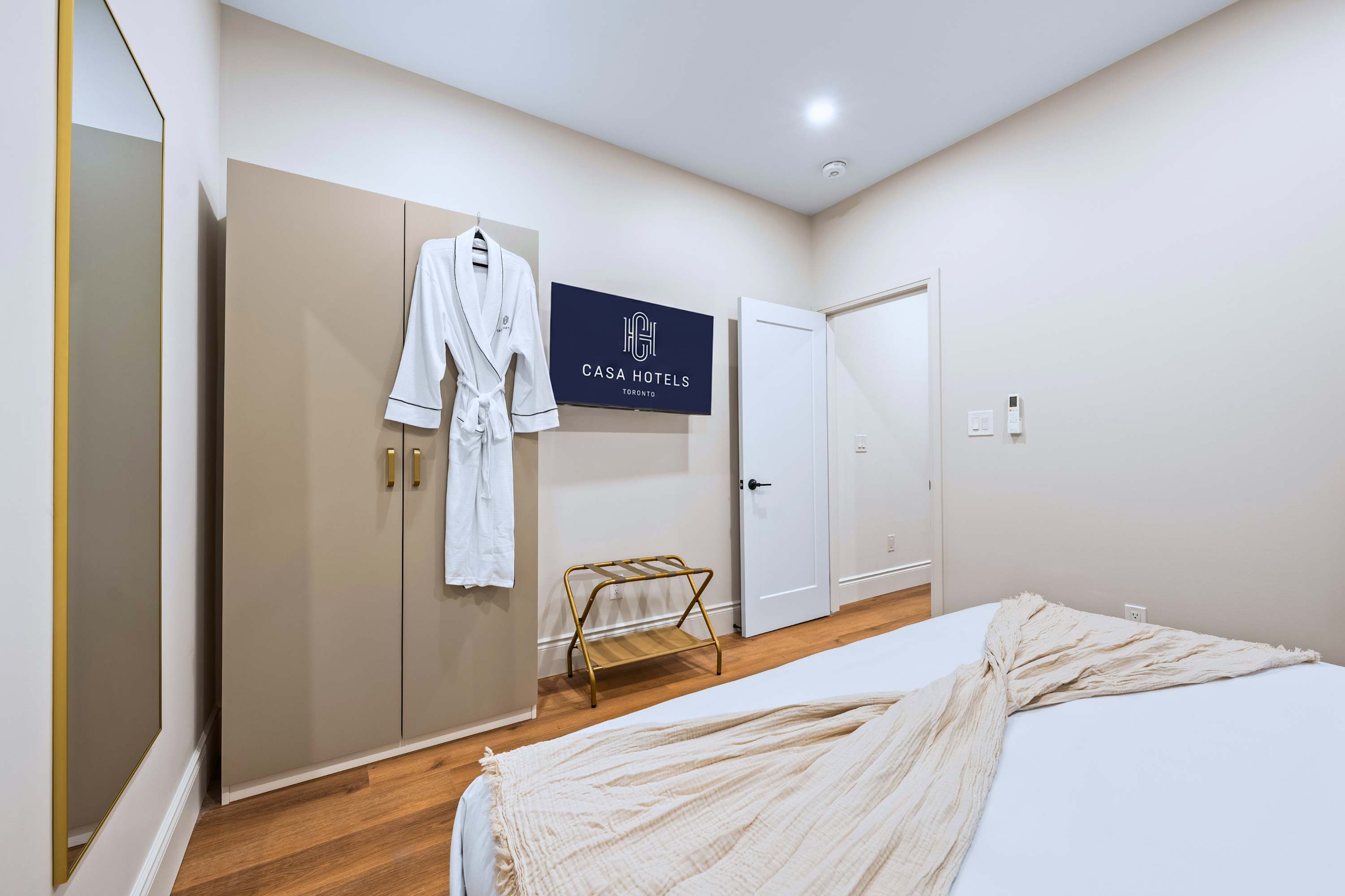 King bed with comfy robe and Smart TV for relaxed nights