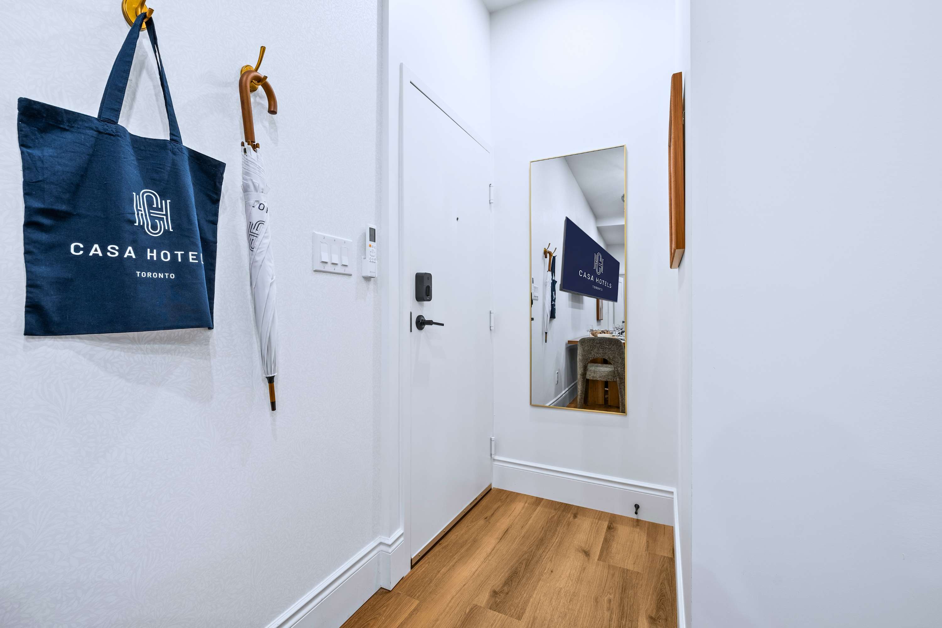 Entry area with mirror, umbrella, and tote bag so you’re ready to step out anytime
