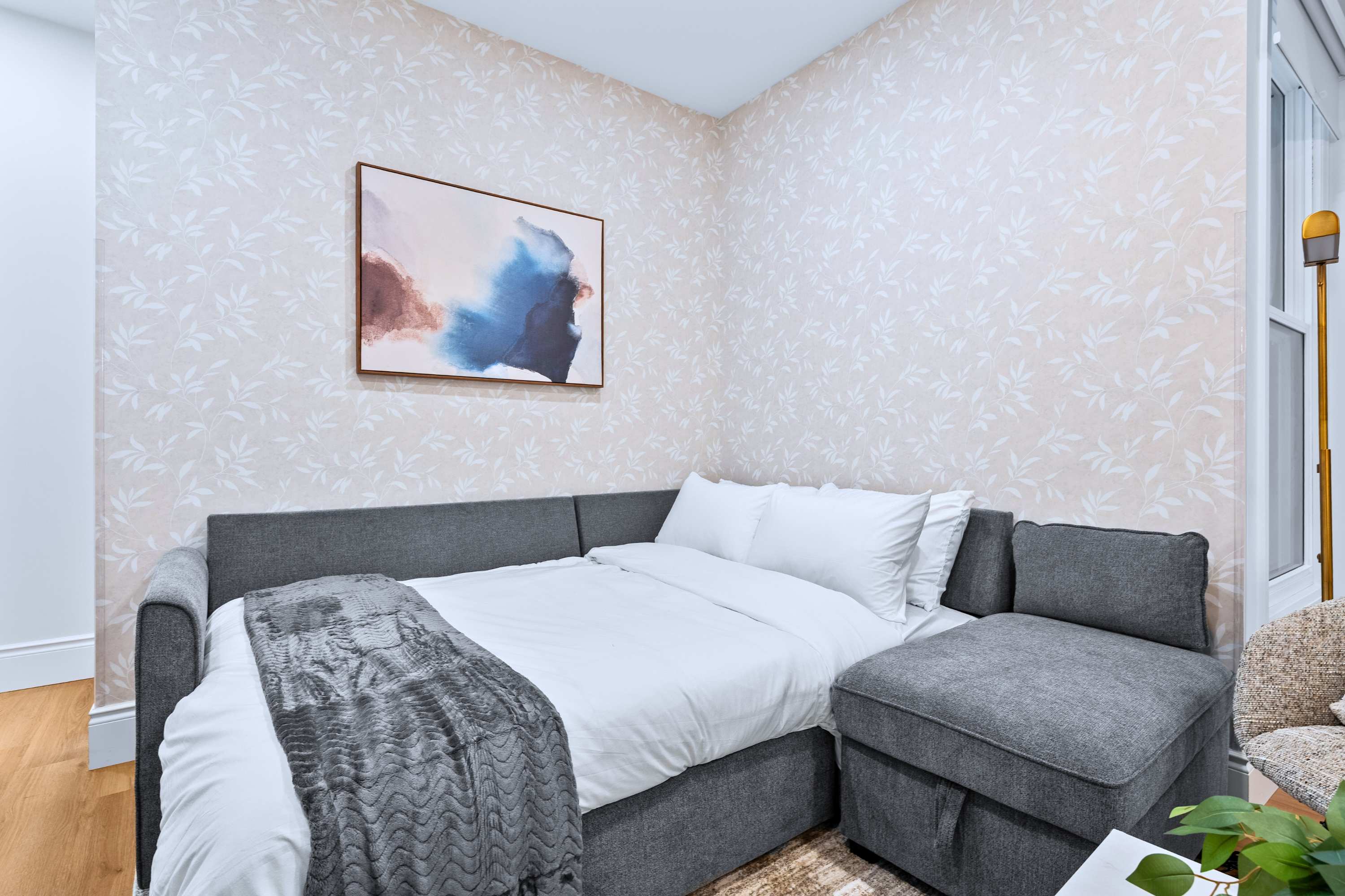 Living area with a convertible sofa for added flexibility and comfort