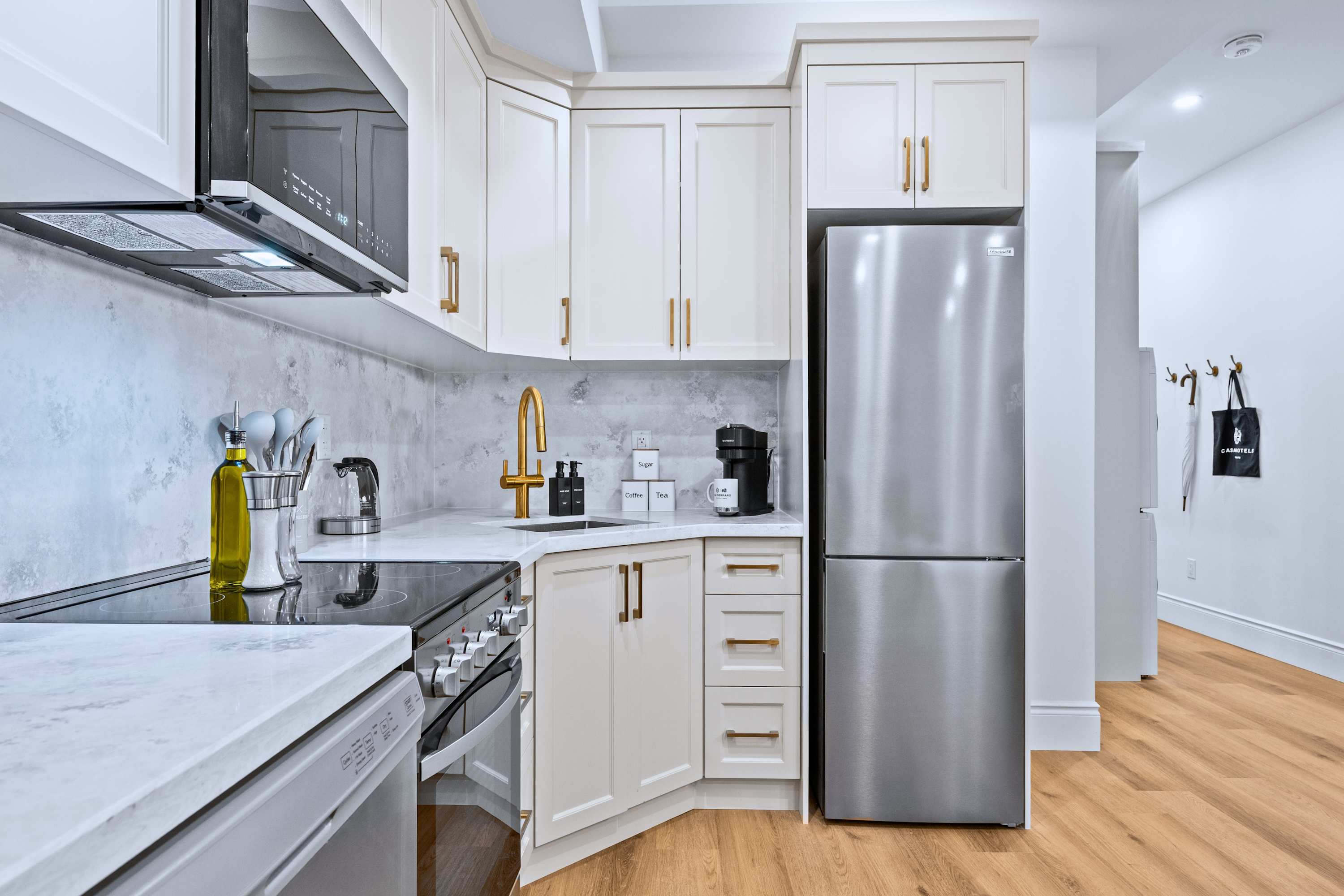 Kitchen with easy flow to shared spaces for cooking while staying connected with guests