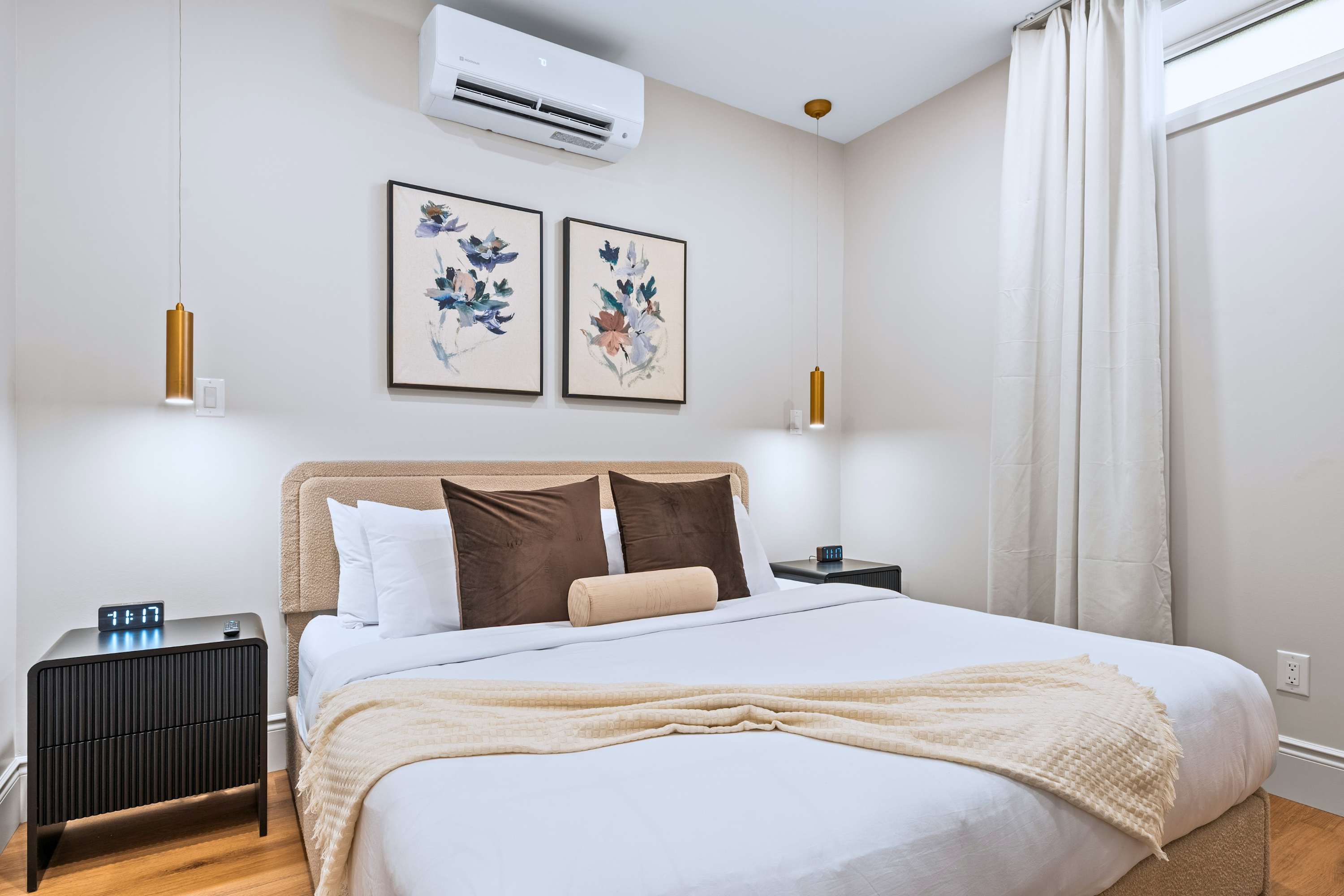 King bedroom with soft lighting and cool comfort for a restful stay