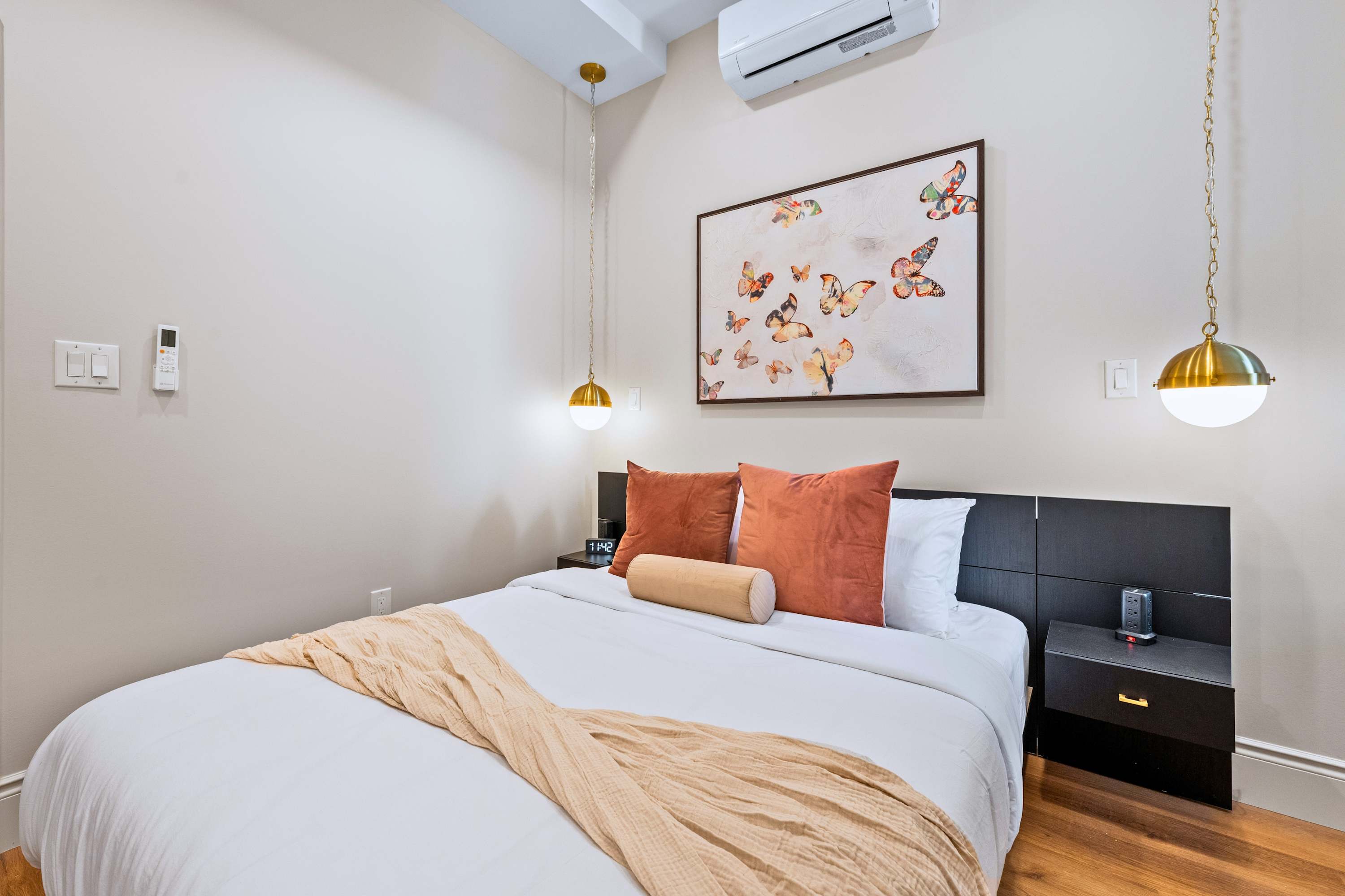Queen bed with premium bedding, pillows, and blankets for restful nights