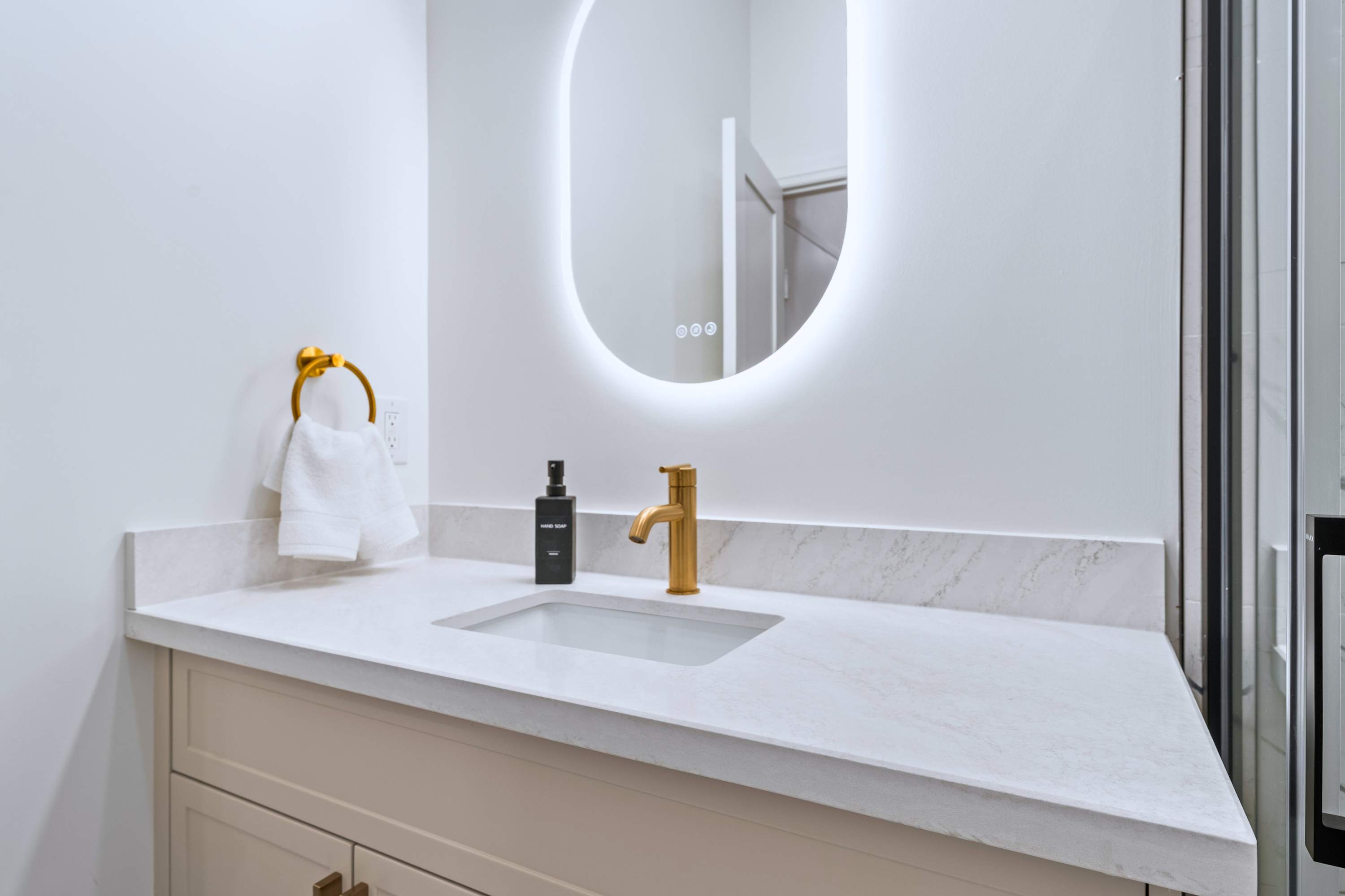 Bathroom with walk in shower and lighted mirror perfect for getting ready or OOTD