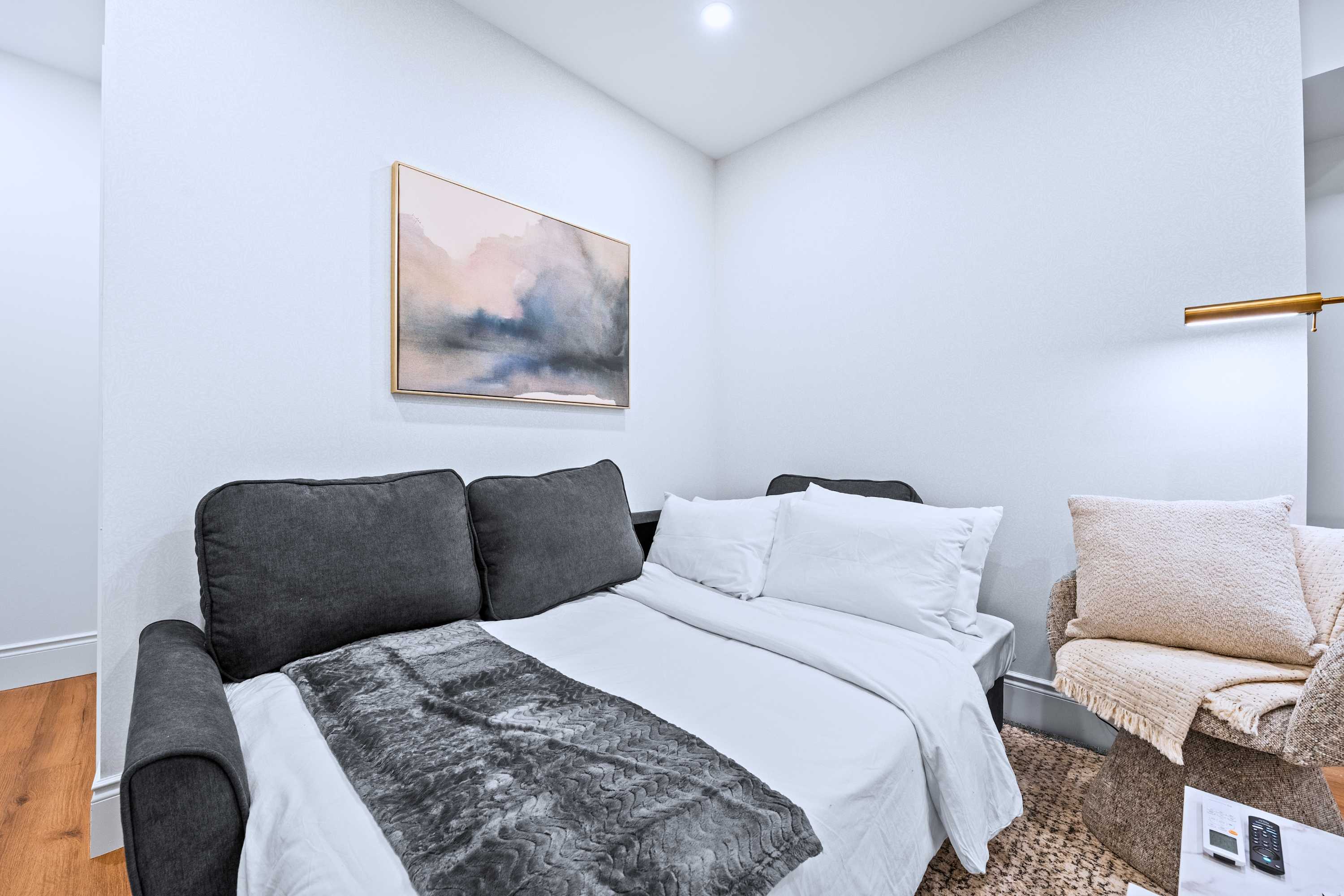 Convertible sofa bed offers added flexibility for extra guests.