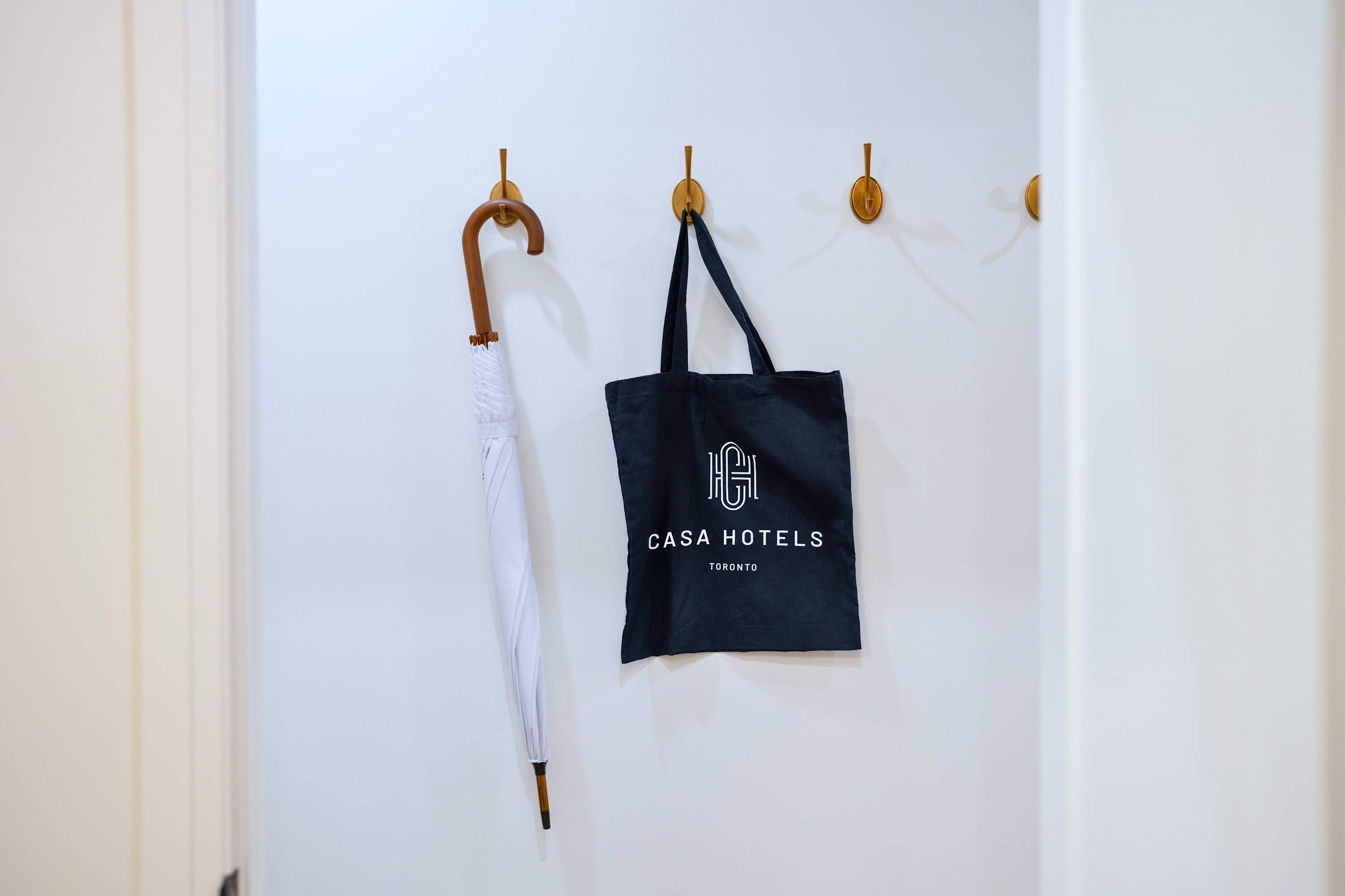 Casa Hotels umbrella and tote bag for light, effortless movement through the city
