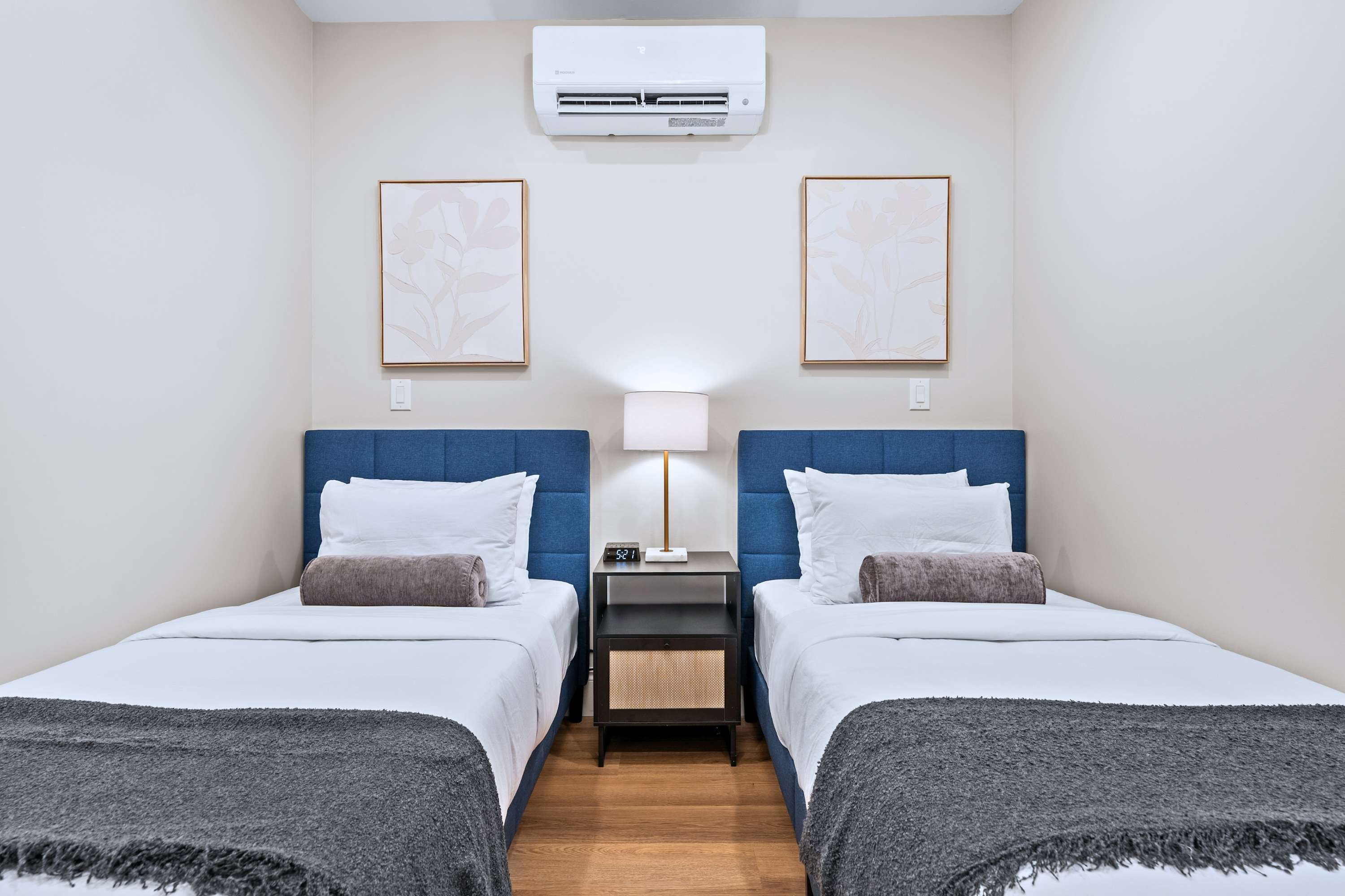 Shared room with two single beds, offering a comfortable setup for rest and easy downtime