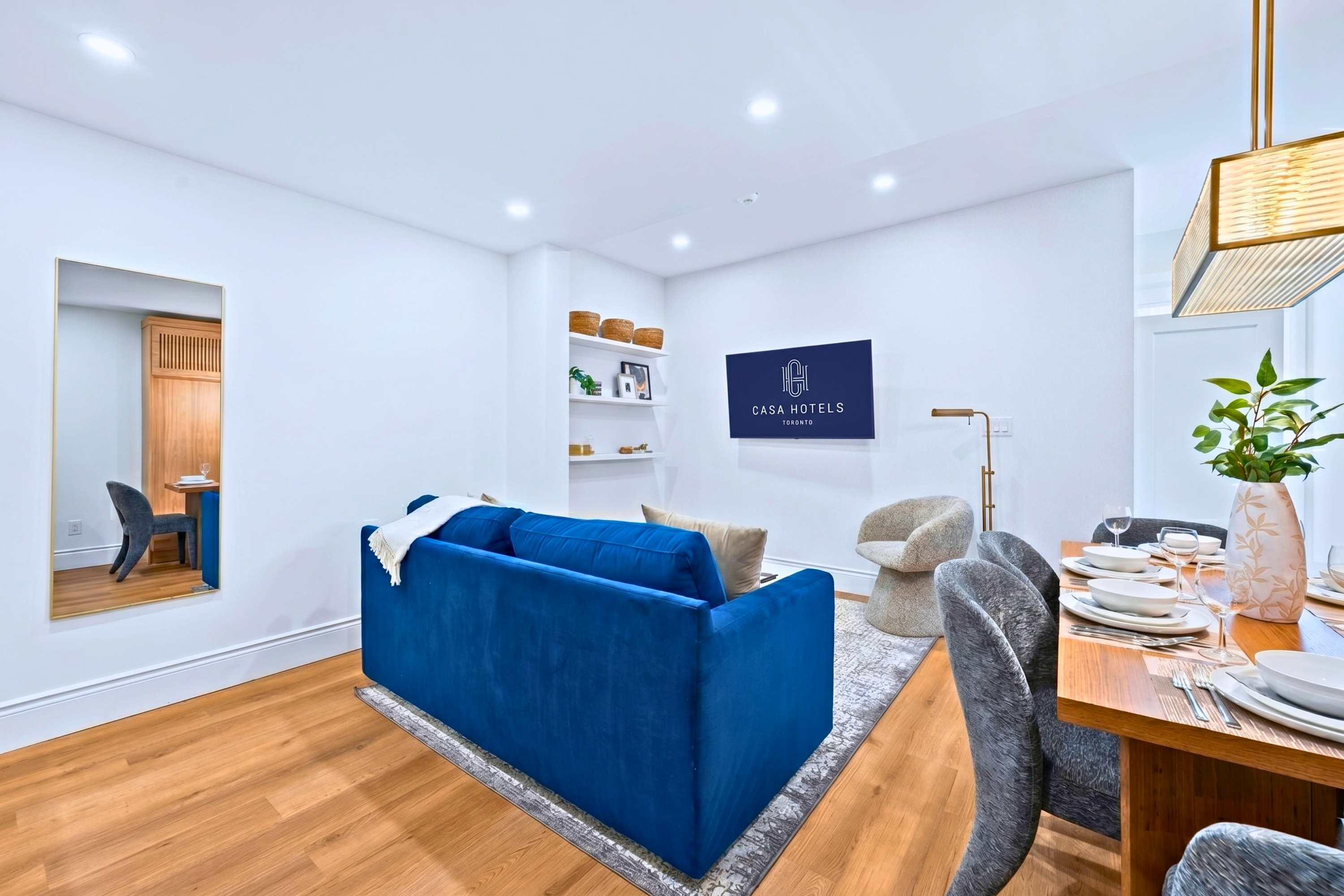 Living space featuring a sleeper sofa, Smart TV, and dining access for guest convenience.