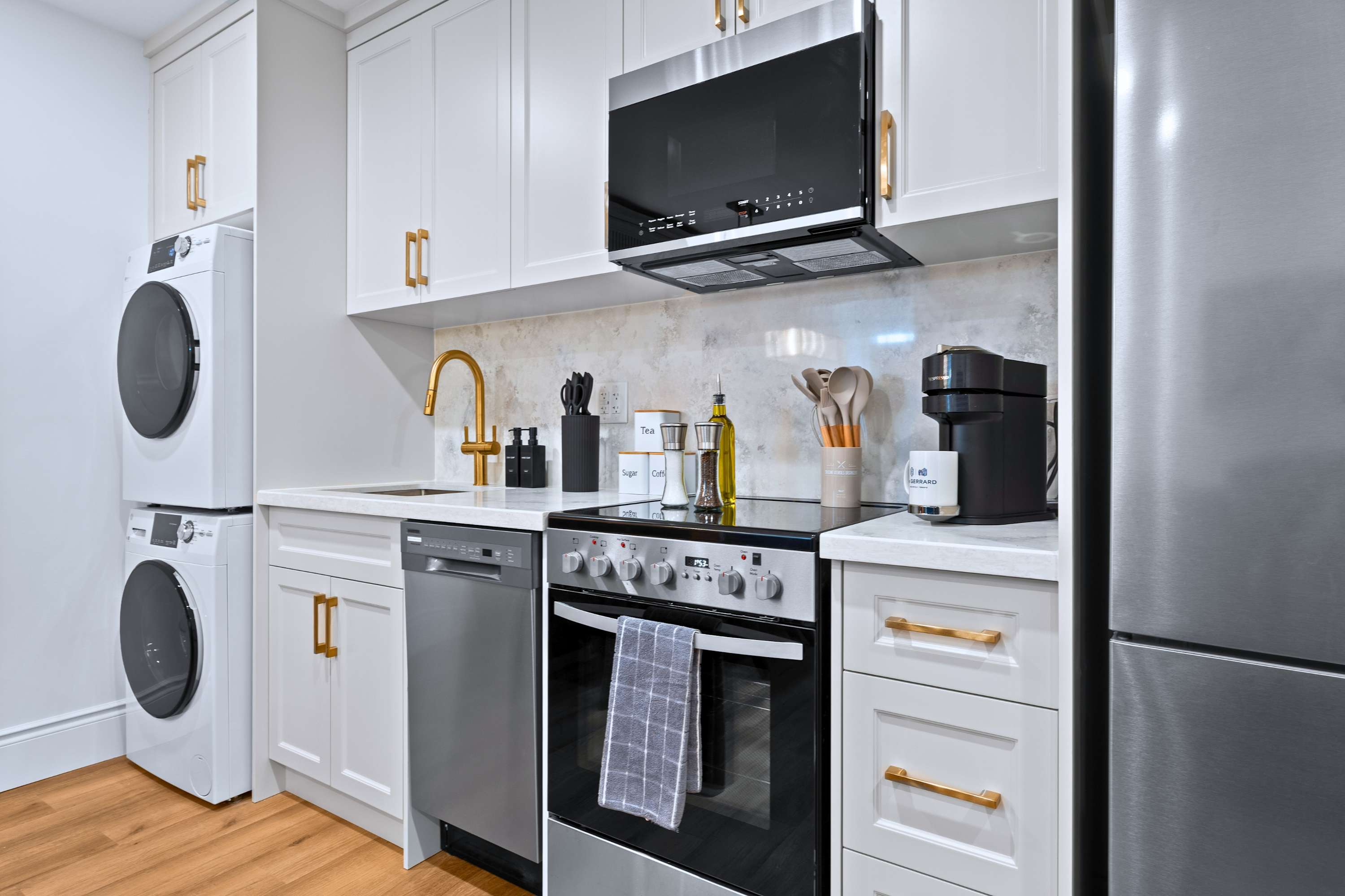 Clean, efficient kitchen and in suite laundry.