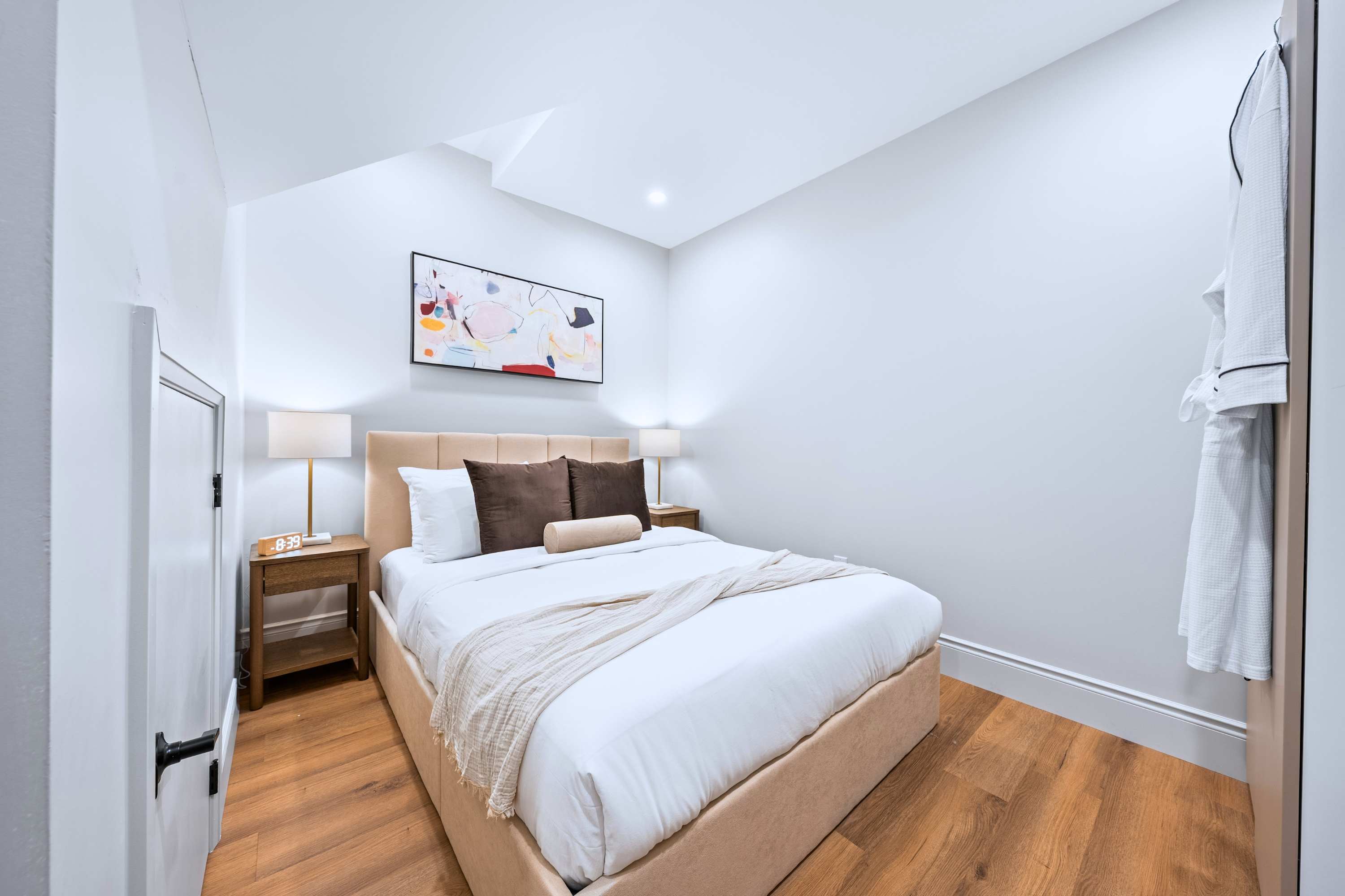 Relax in this queen-sized bedroom with a warm and inviting feel.