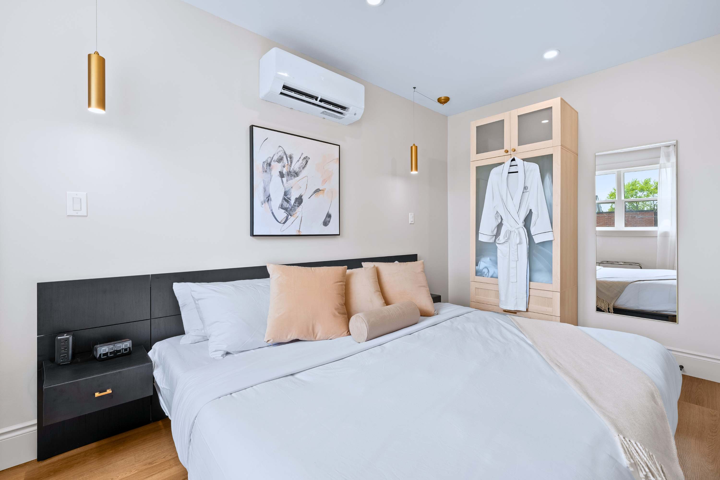 Relax in the warmth of this king-sized bedroom while you're wrapped in a soft bathrobe.