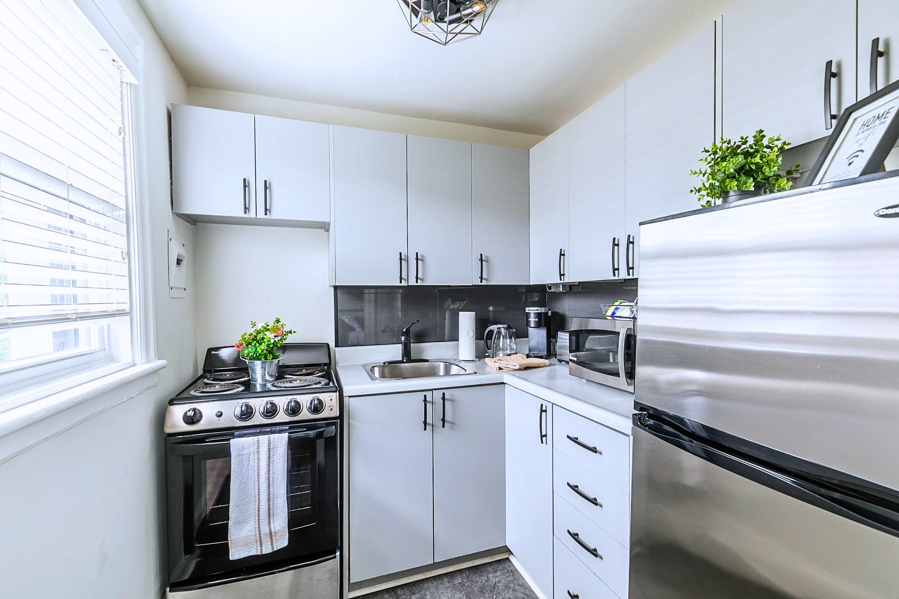 Kitchen With Modern Appliances And Clean Countertops