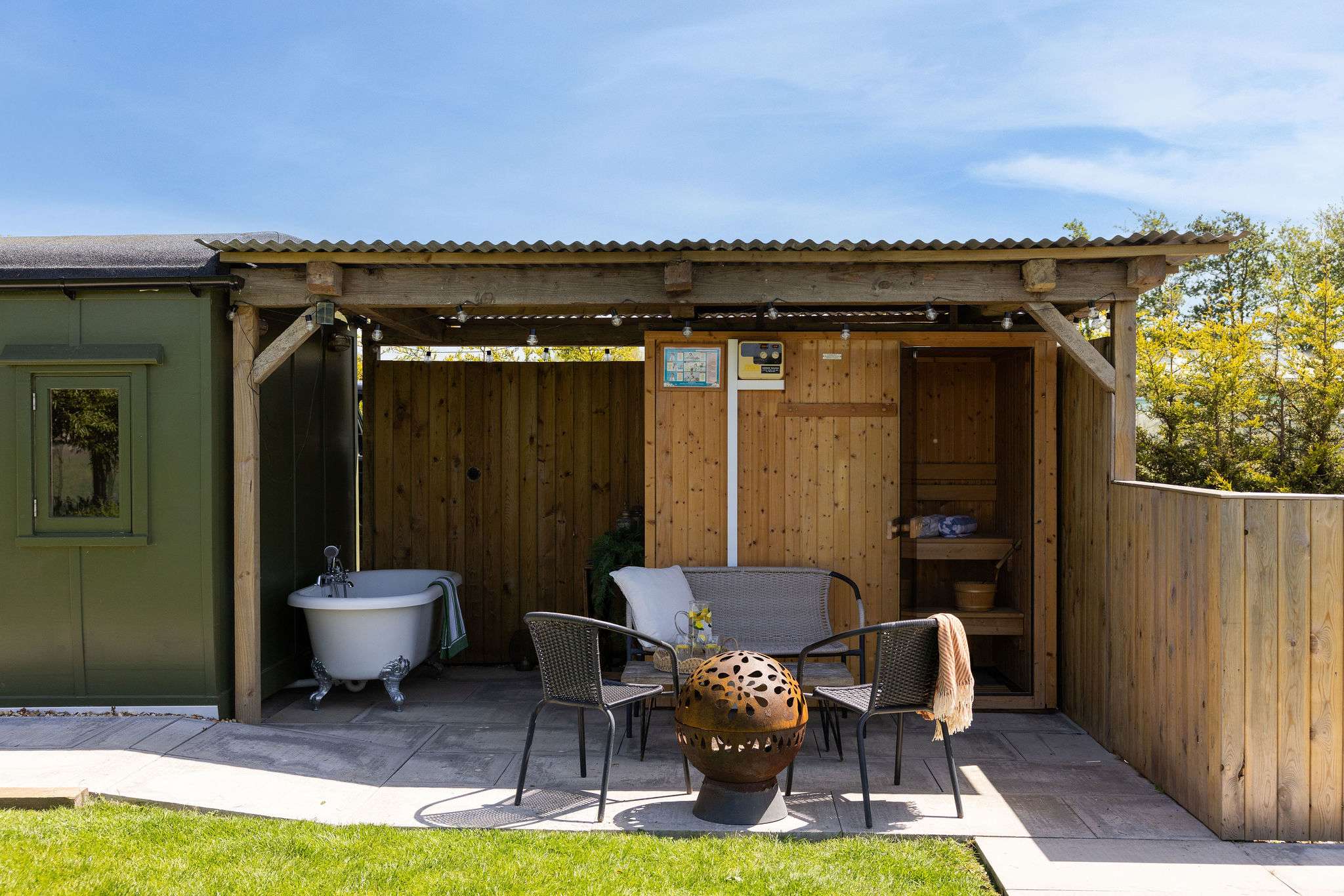 Outdoor relaxation at its best. Our WW2 train carriage comes with a private patio and a charming outdoor bathtub for a refreshing soak and sauna!