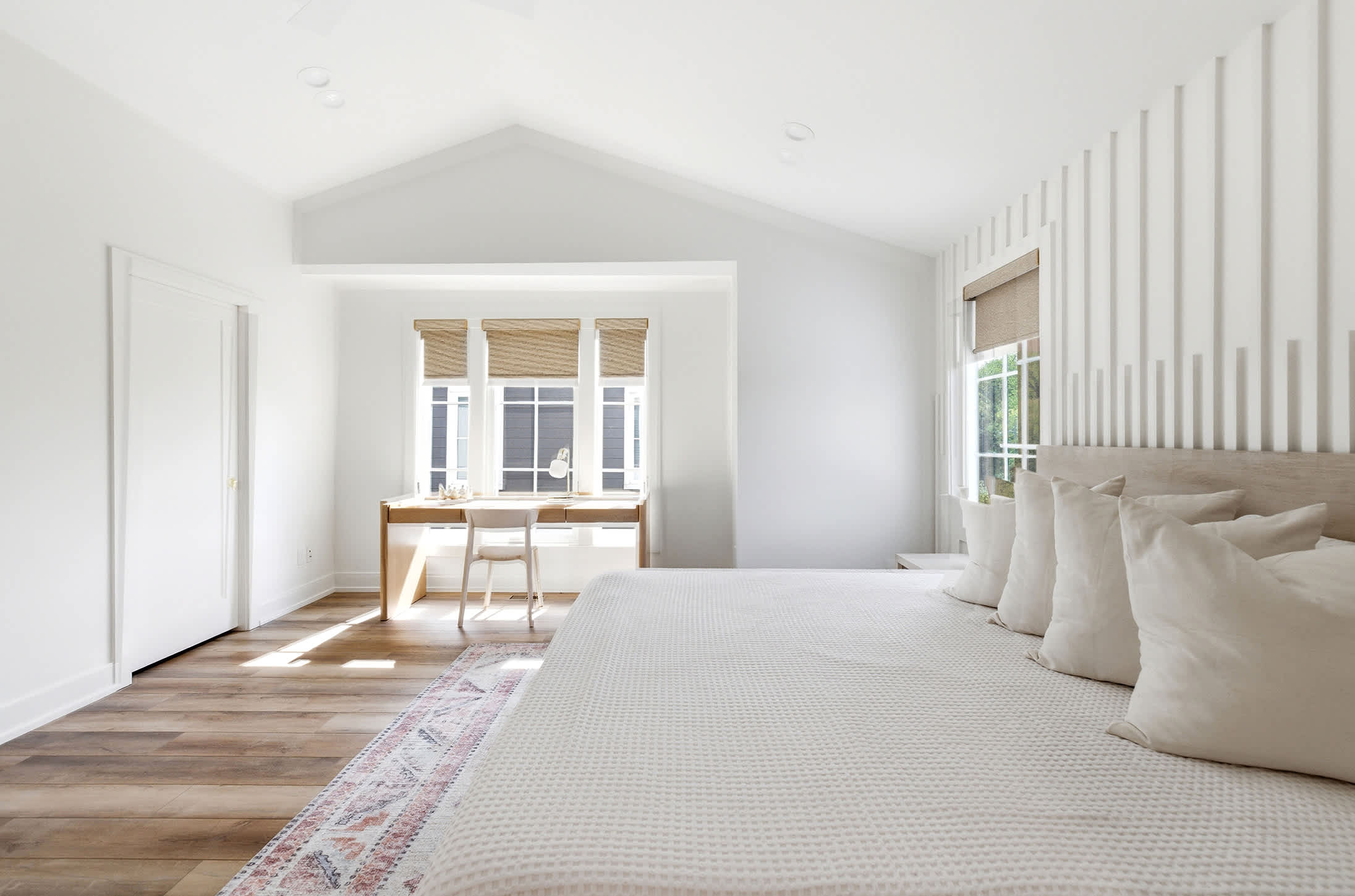 Primary bedroom is on the upper level and has a king-size bed.