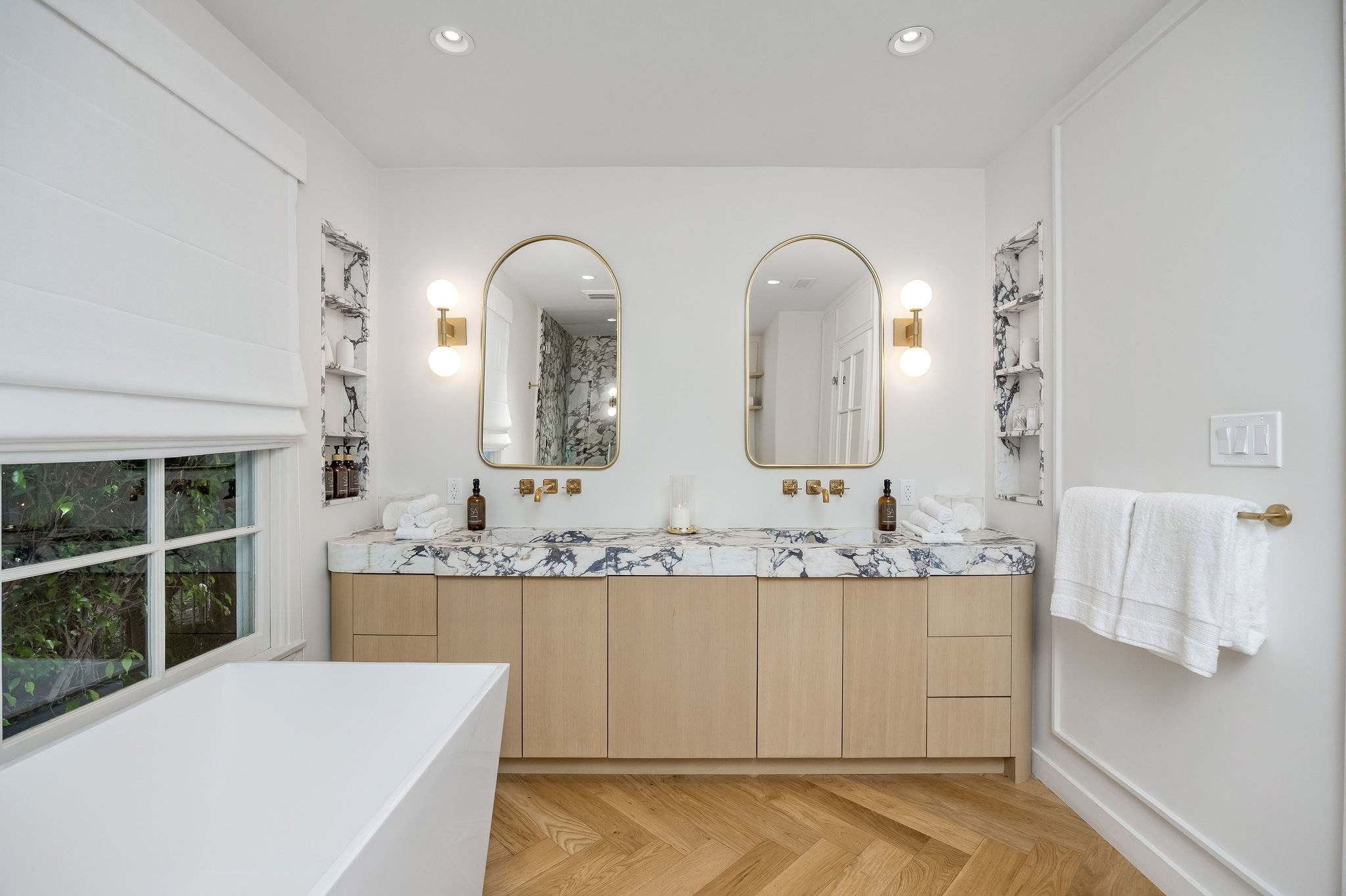 Refresh in a luxurious marble bathroom designed for slow mornings.