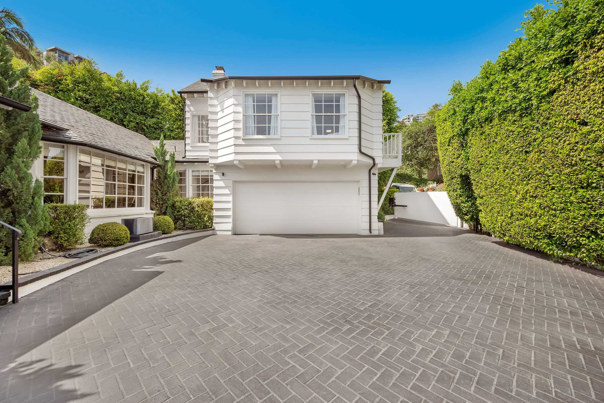 Come and go with ease from your secluded lower Sunset Plaza estate.