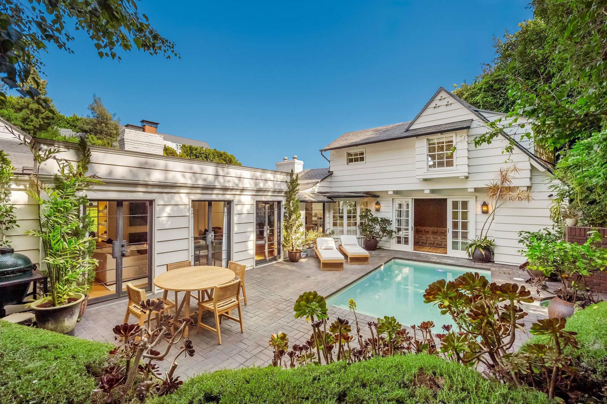 Host memorable evenings in a courtyard designed for effortless entertaining.