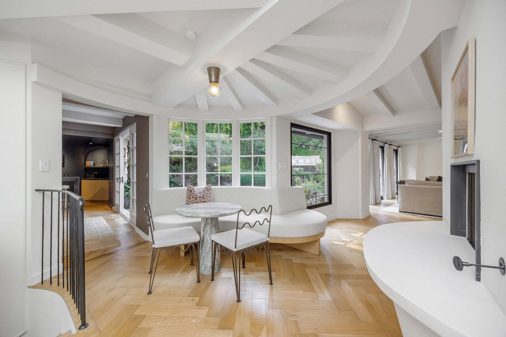 Gather around the table and enjoy views of the lush courtyard beyond.