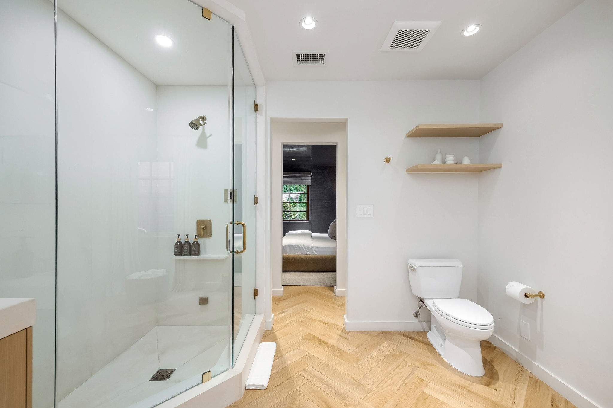 Refresh in a bright spa-inspired bathroom with a spacious walk-in shower.