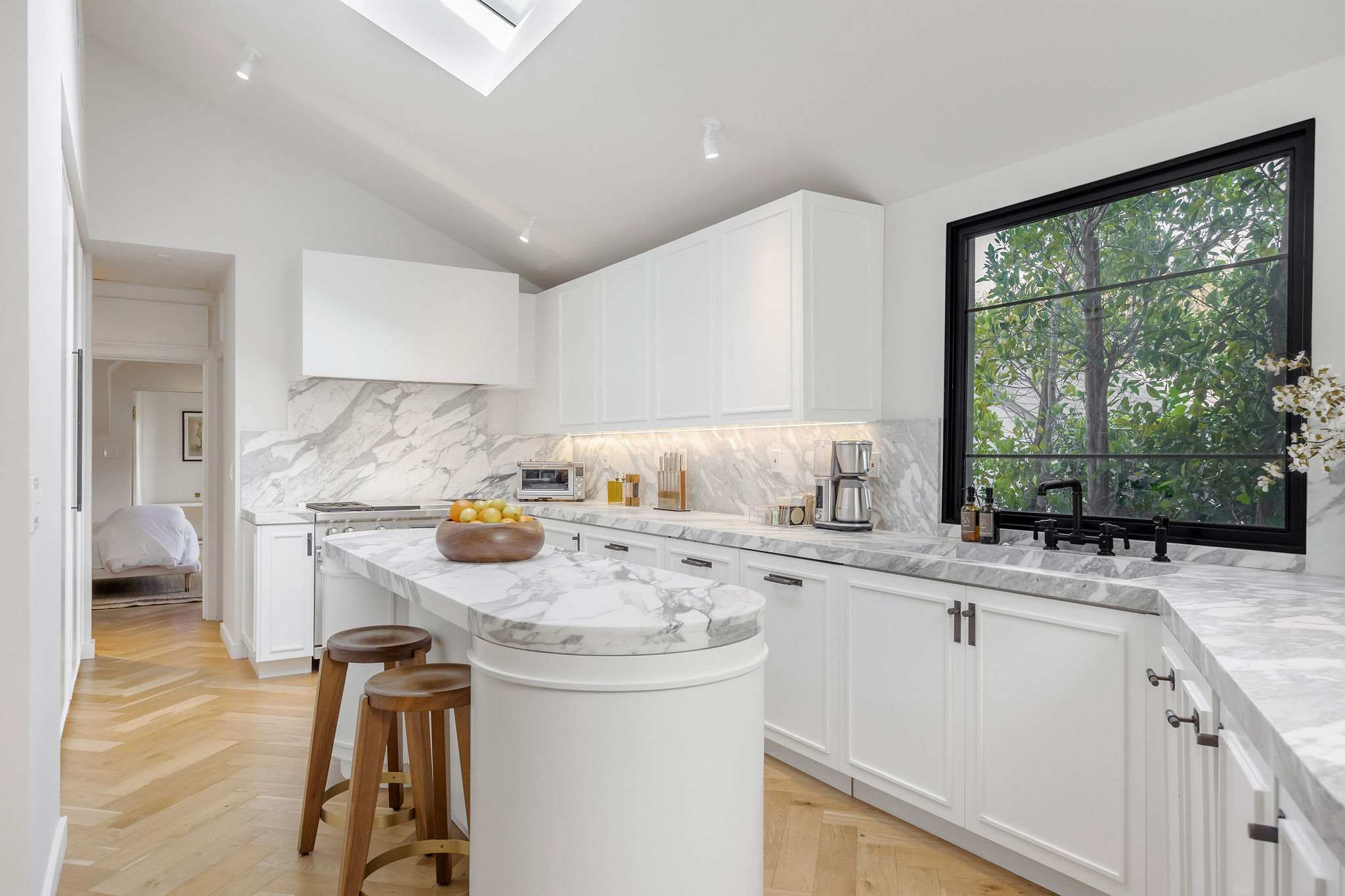 Prepare memorable meals in a chef's kitchen with a waterfall island.